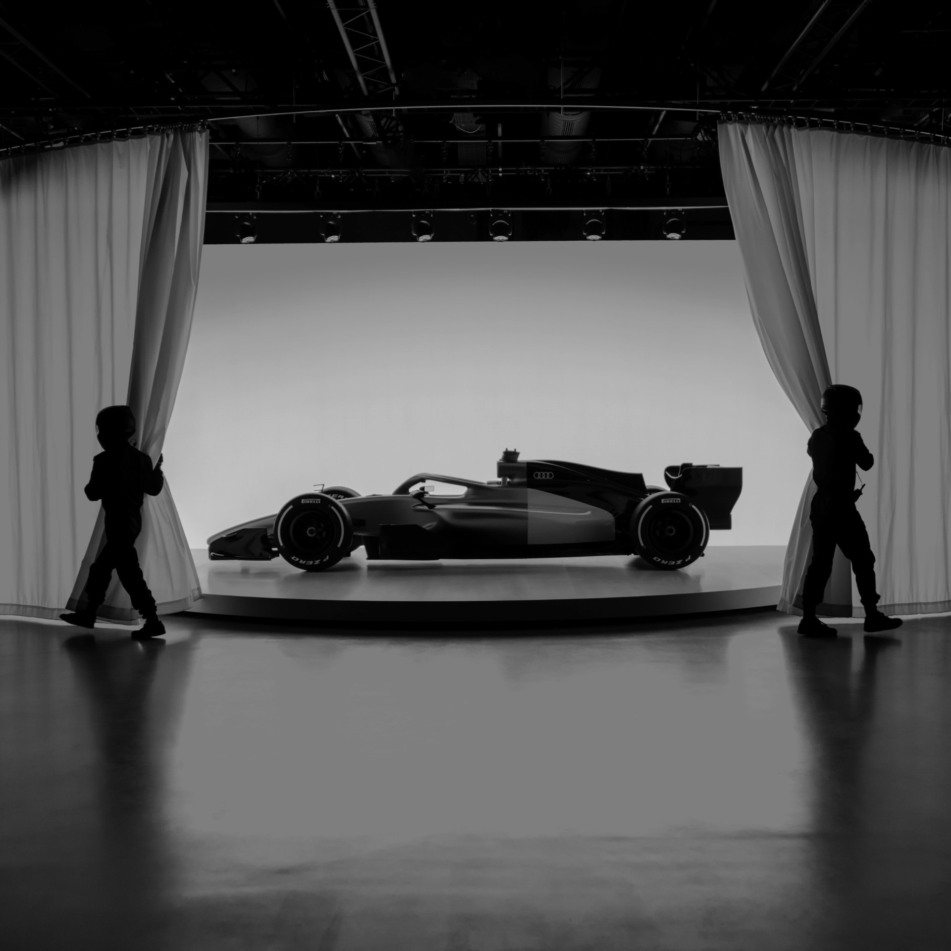 The side profile of the Audi R26 Concept is visible. 