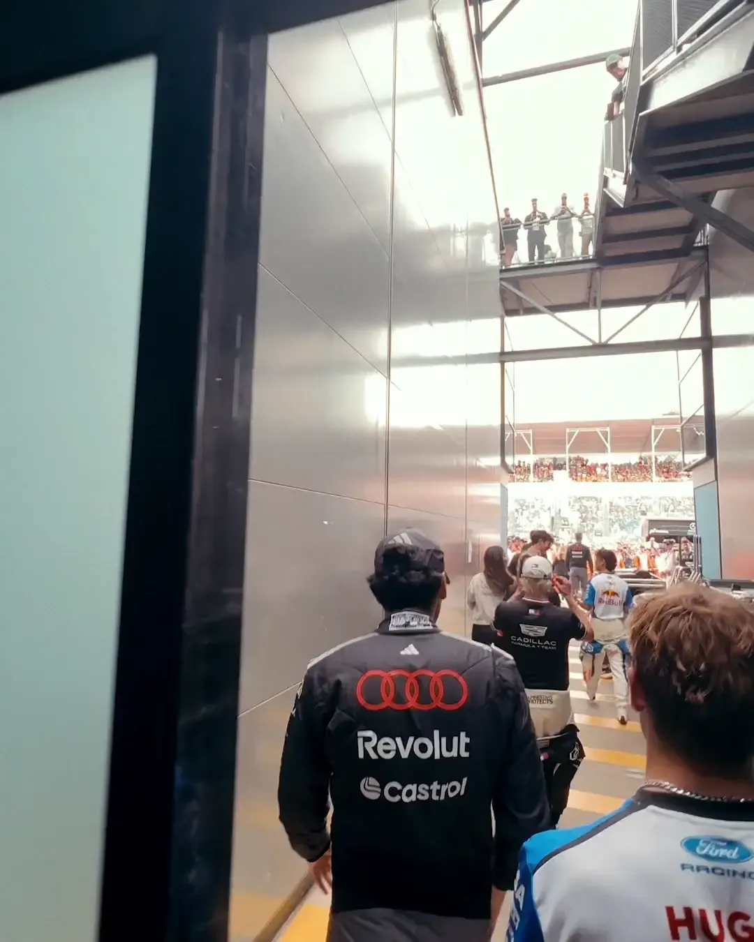 Audi Revolut F1® Team driver walking to the parade vehicle in front of the Melbourne grandstands.