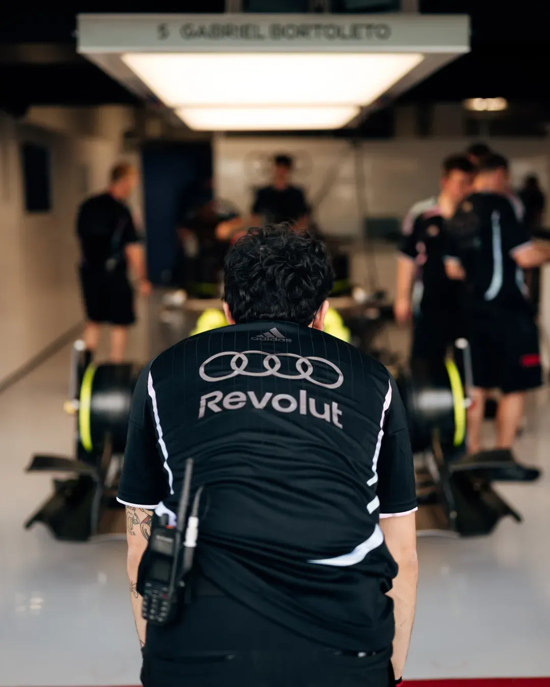 Mechanics preparing car in the garage