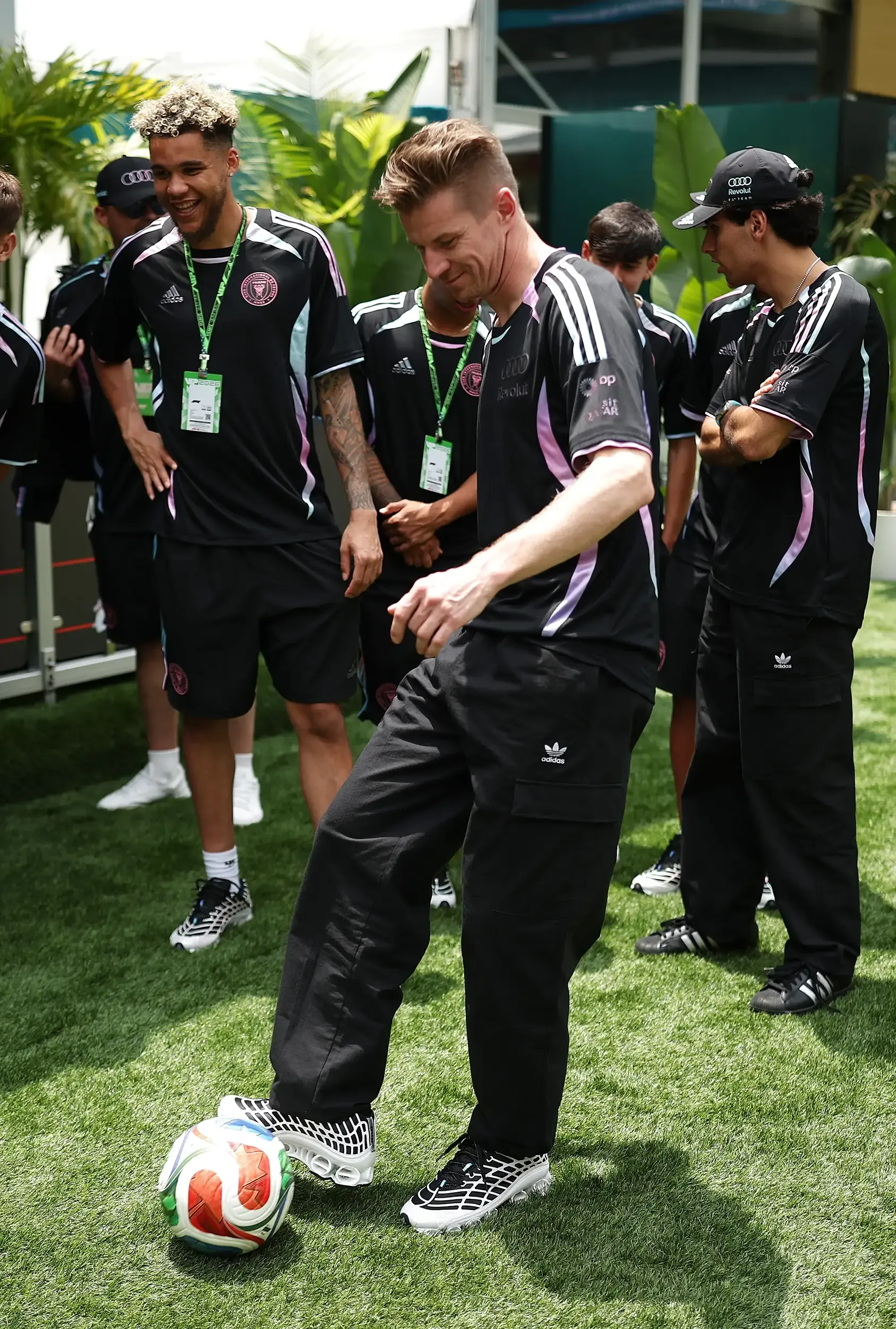 Nico Hulkenberg playing with a soccer ball
