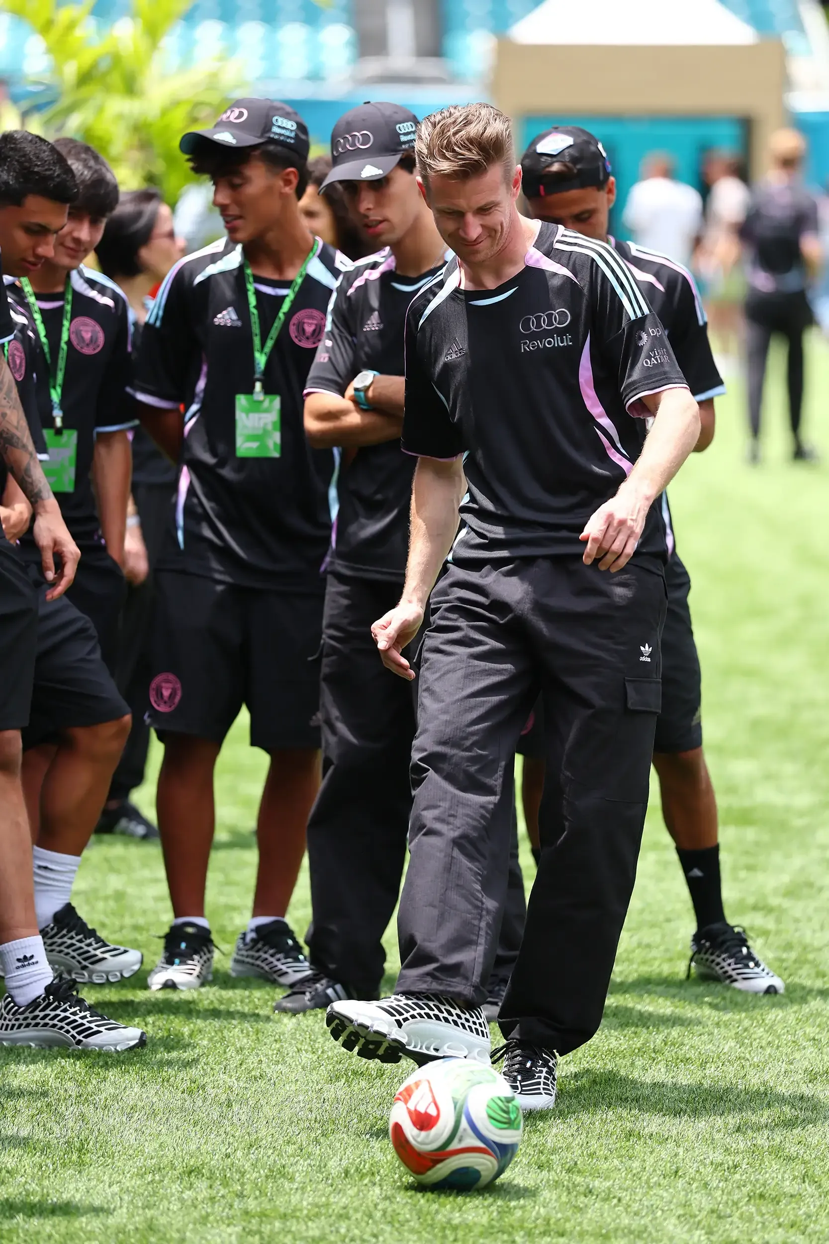 Nico Hulkenberg playing with a soccer ball