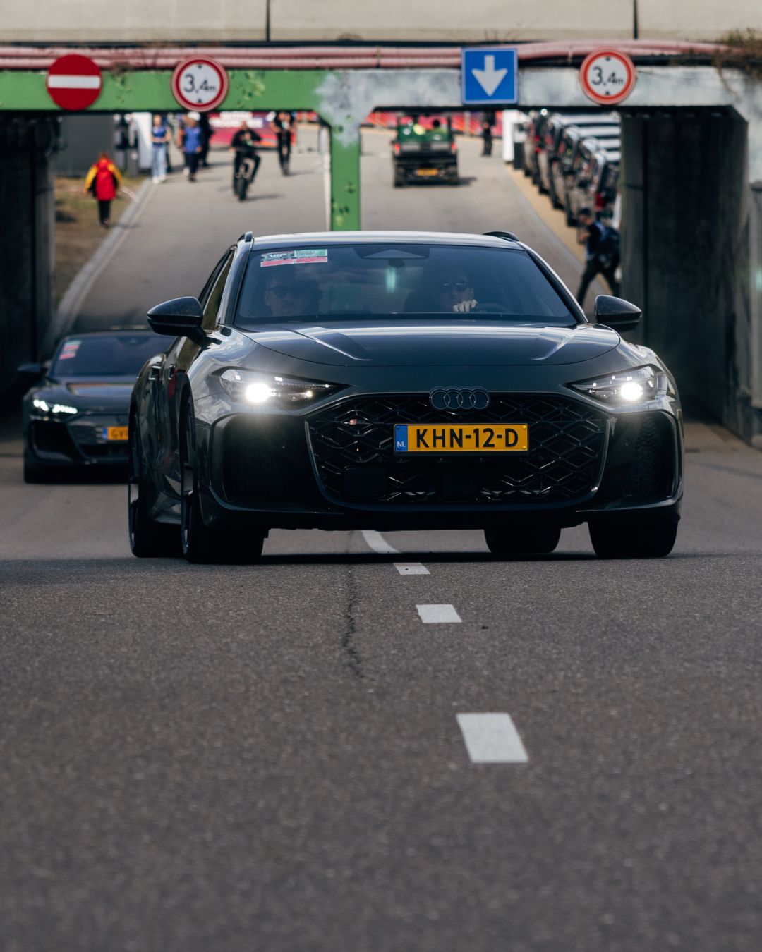 Audi team vehicles in convoy passing through circuit entrance at Zandvoort