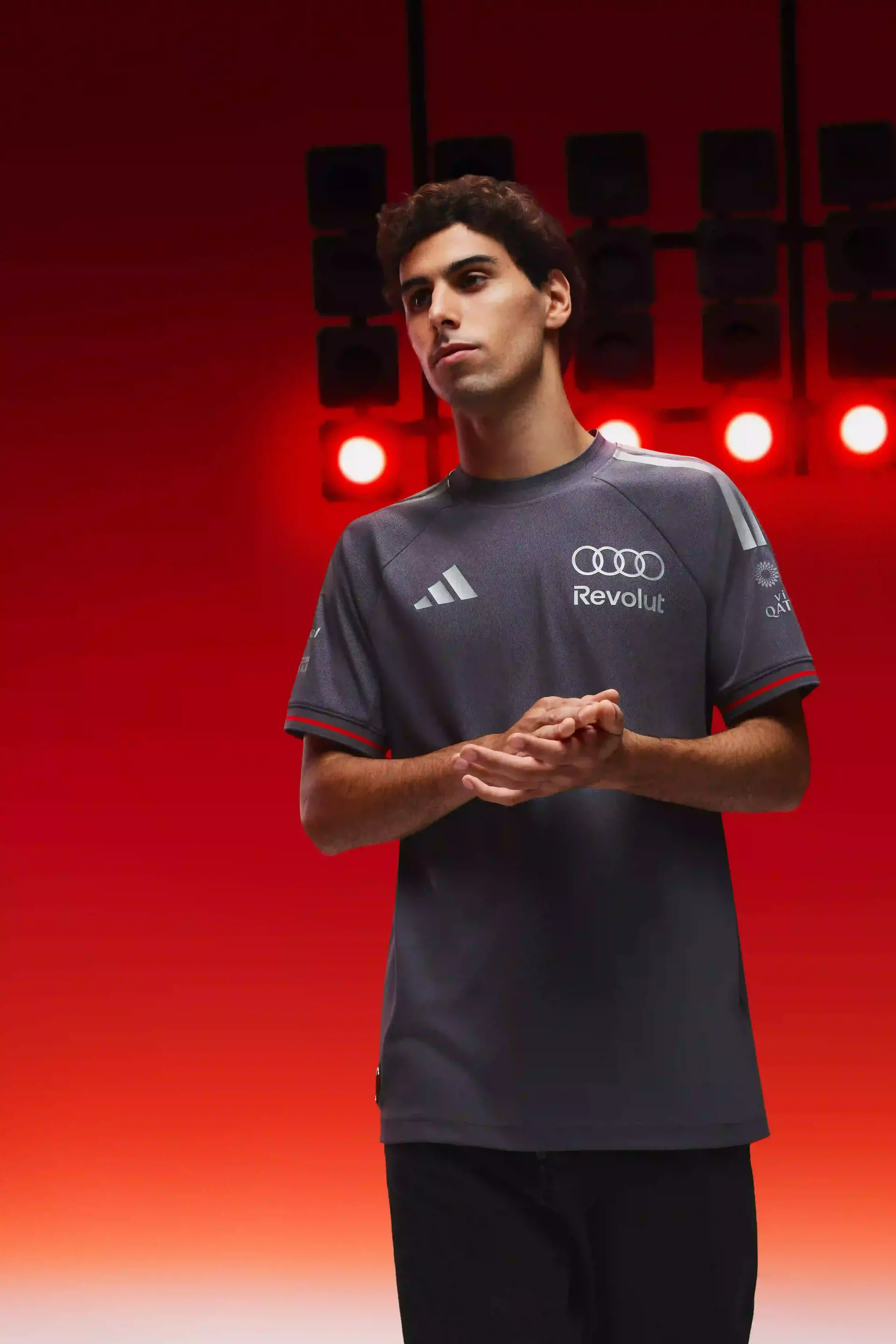 Gabriel Bortoleto wearing an authentic Team Jersey shirt, dark grey, with orange accents, white adidas and Audi rings Logo, driver AUDI REVOLUT F1®Teamwear
