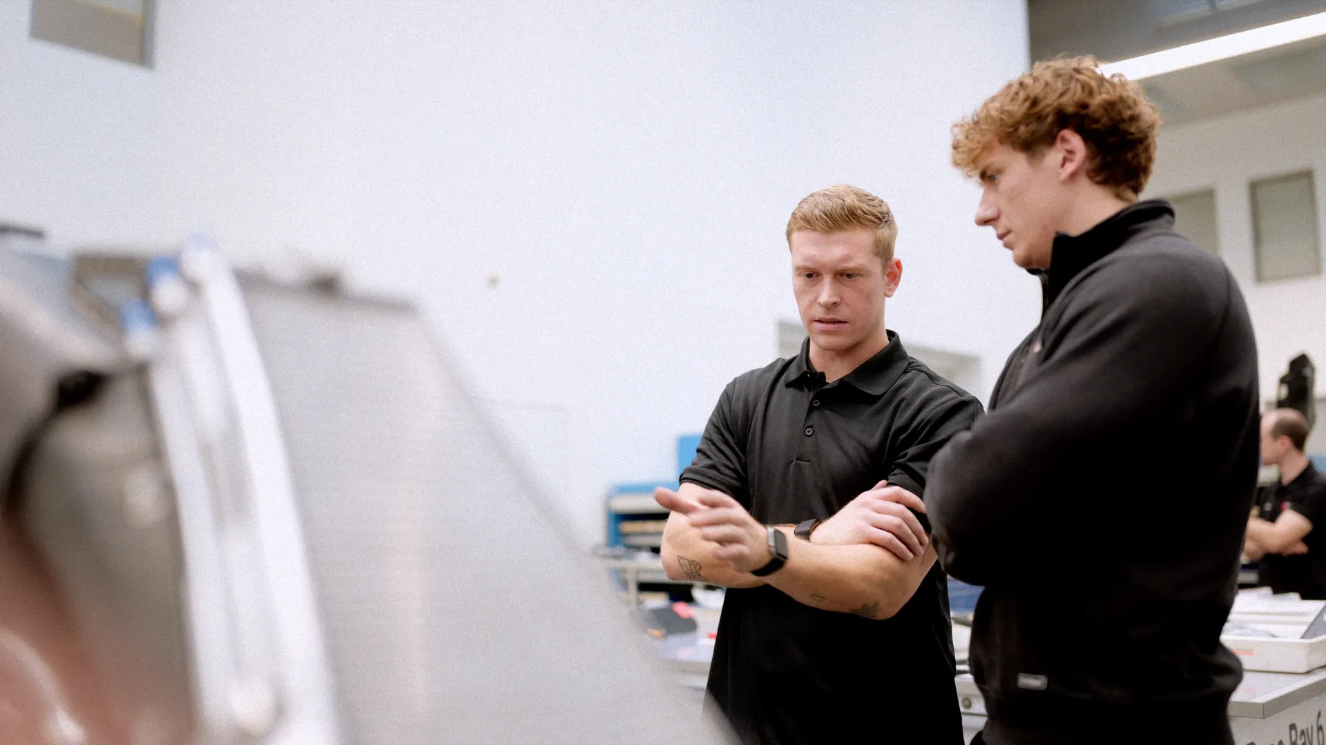 Two internship program participants looking and discussing a subject
