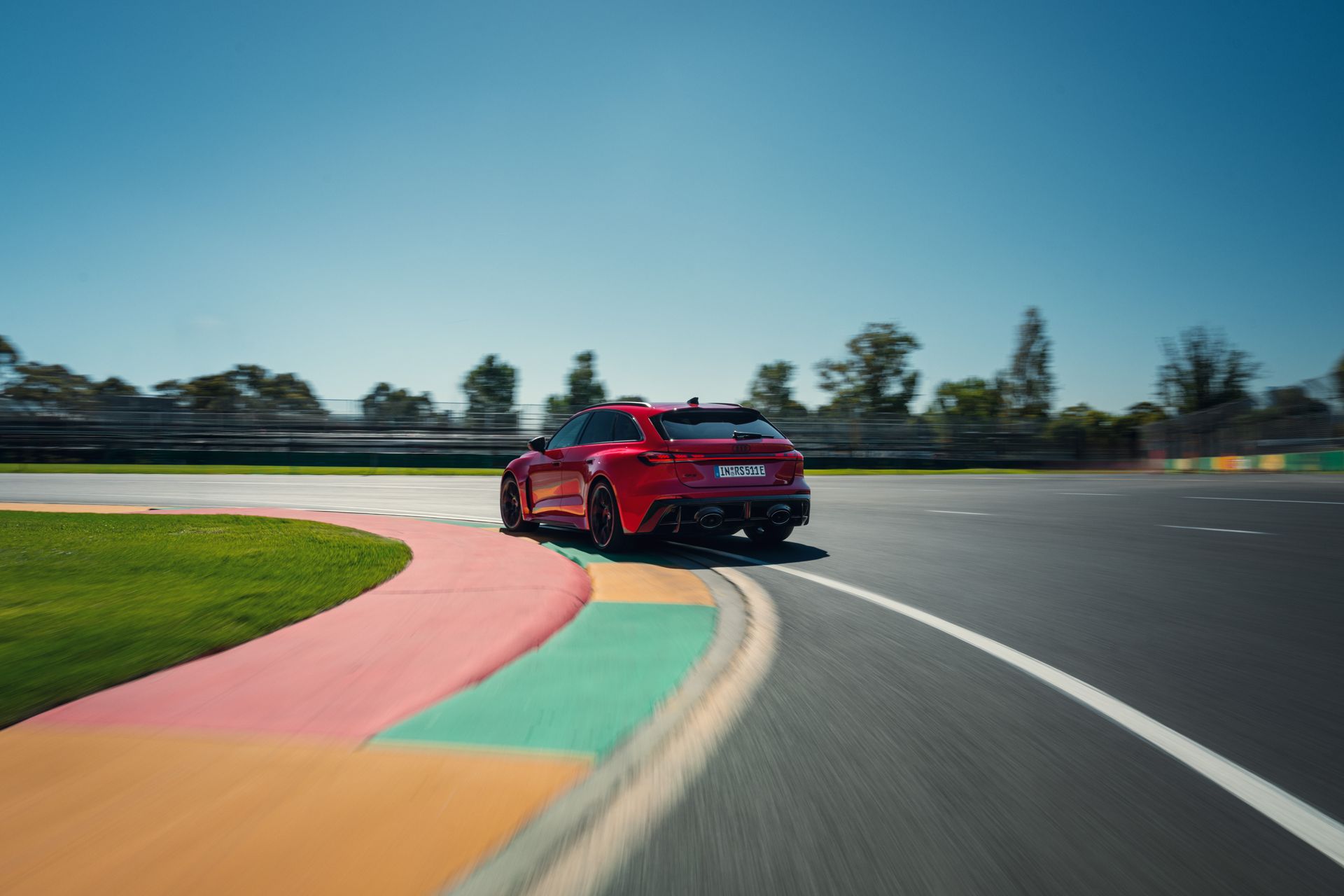 Audi RS5 ReconnaissanceMission car from behind driving on track around a corner