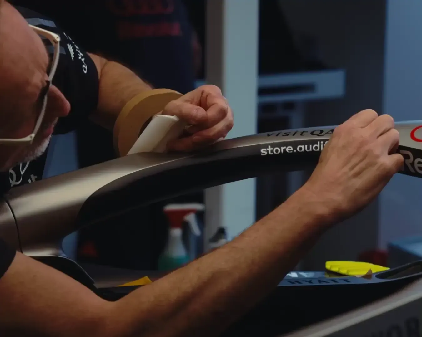 team member is setting up stickers on the halo of the R26