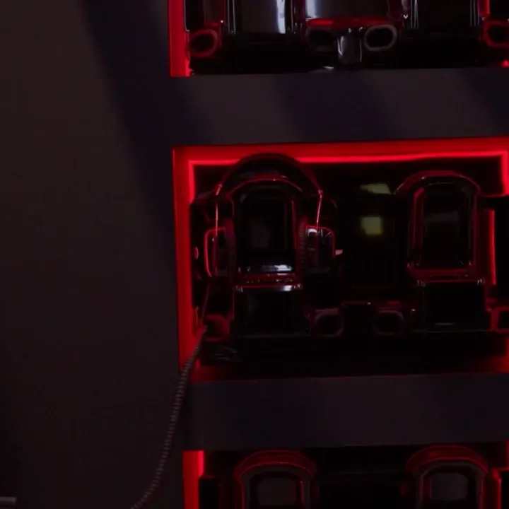 Short video close ups from Eleven Labs headphones, blond female crew member putting on headphones, zoom out of the Audi Revolut F1® Team Car