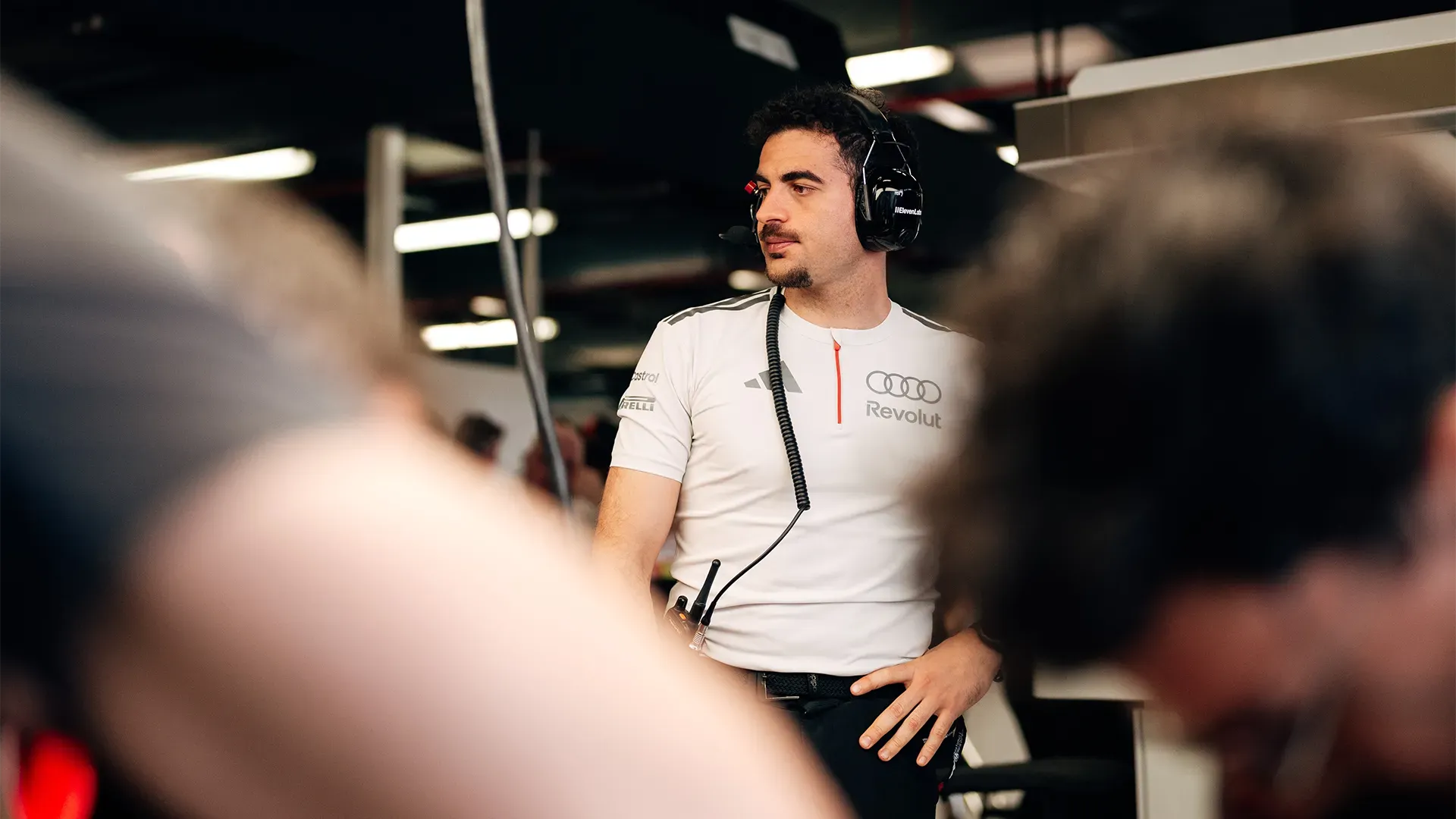 A Team member is checking the progress in the pit