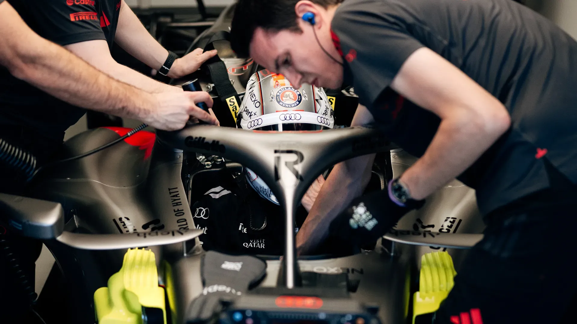 Nico entering the car with mechanics around him