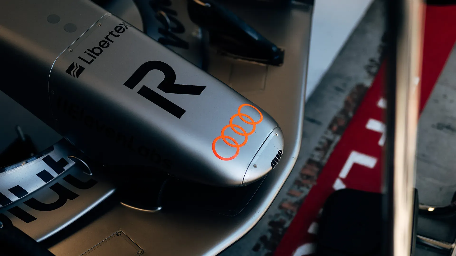 The nose of the car in detail with the red audi rings