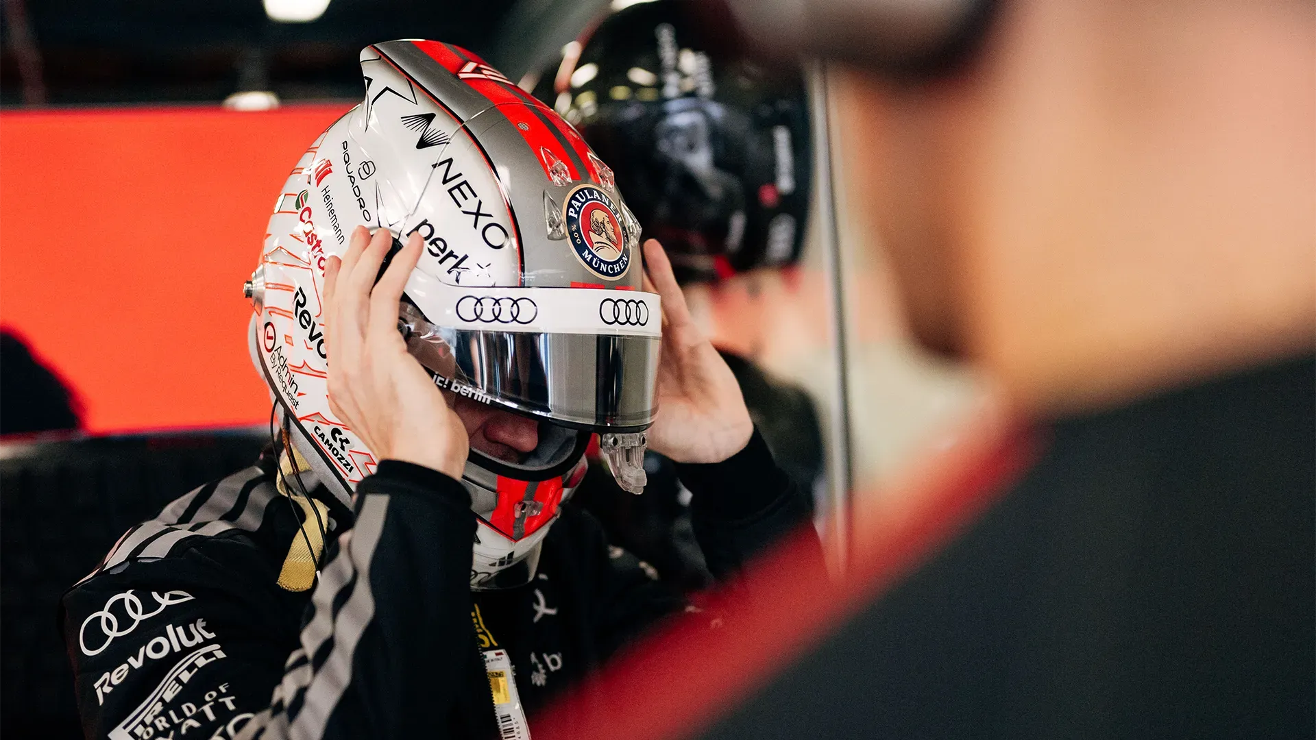 Nico putting his helmet on