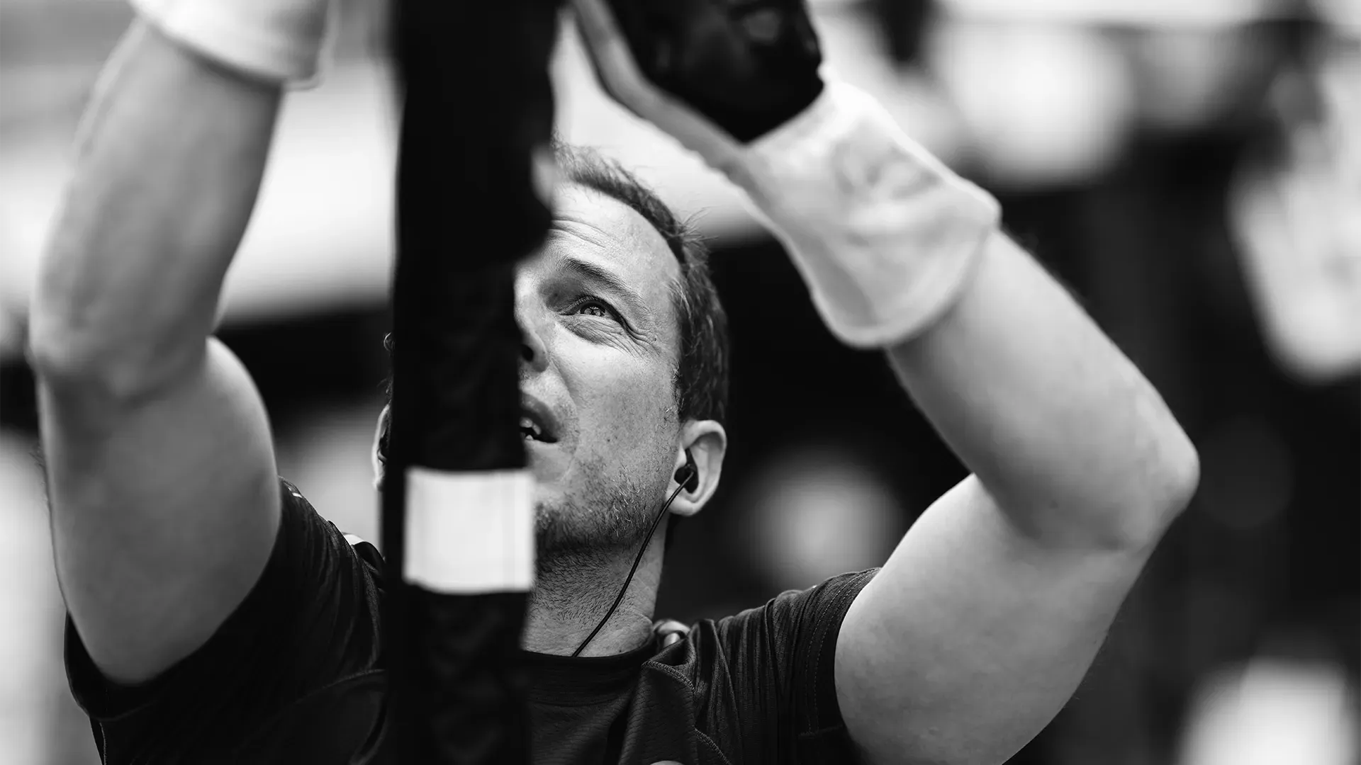 A team member is setting up the hydraulic hoses