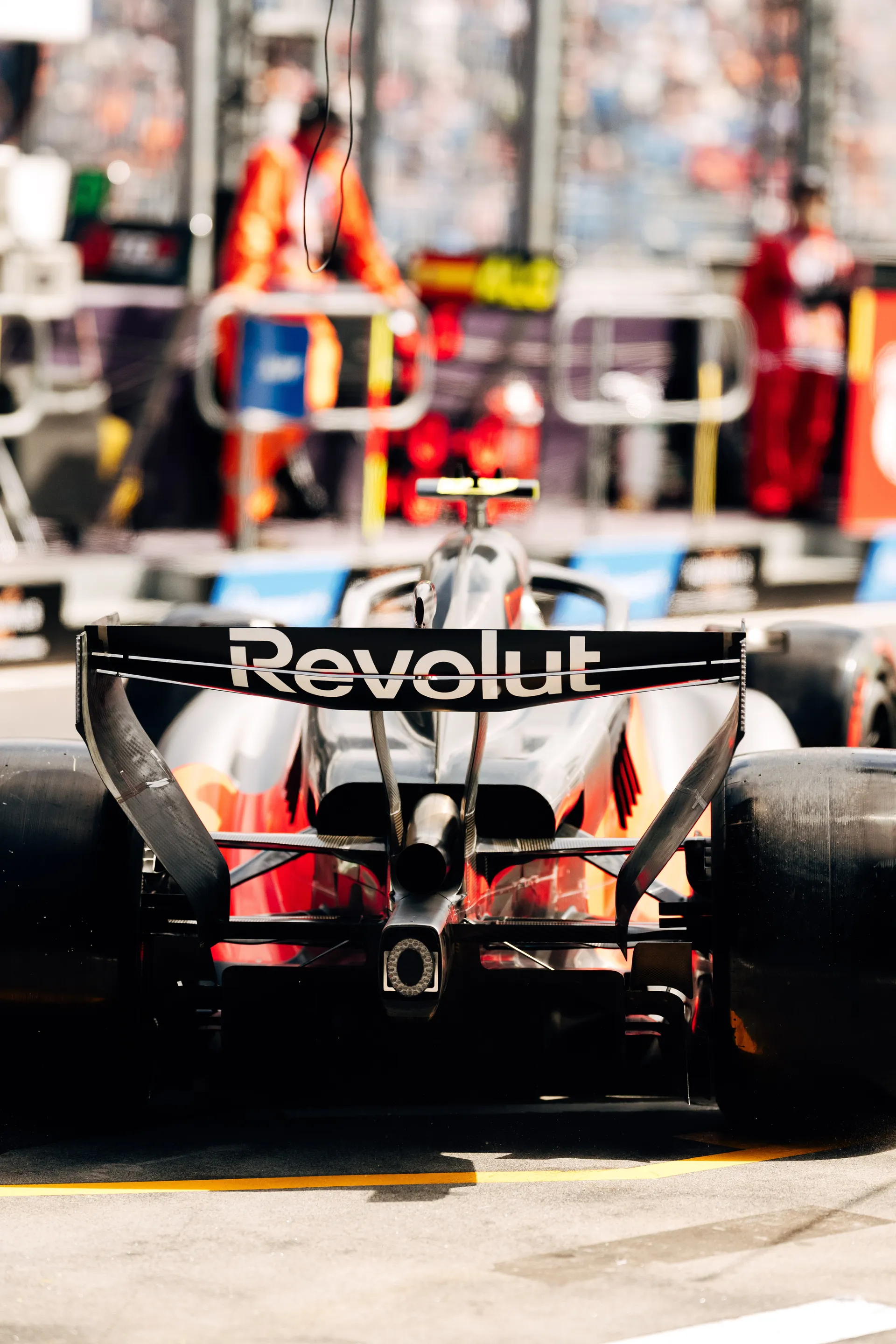 Rear view of the Audi Revolut F1® Team R26 in the pit lane, with the Revolut rear wing in focus during qualifying.