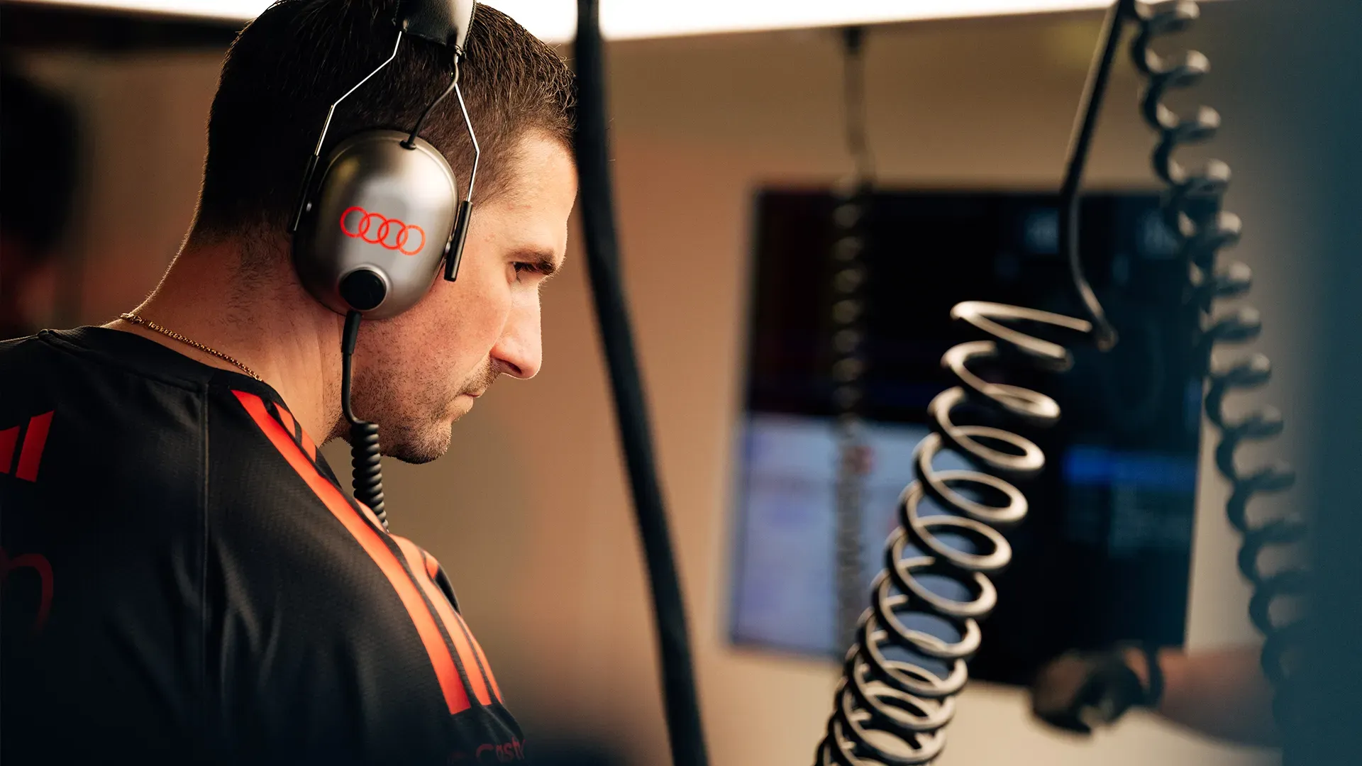  A team member with headphones checking something in the garage