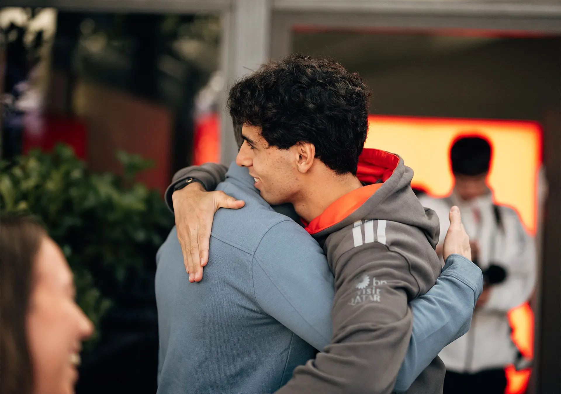 Gabi hugging and welcoming a person