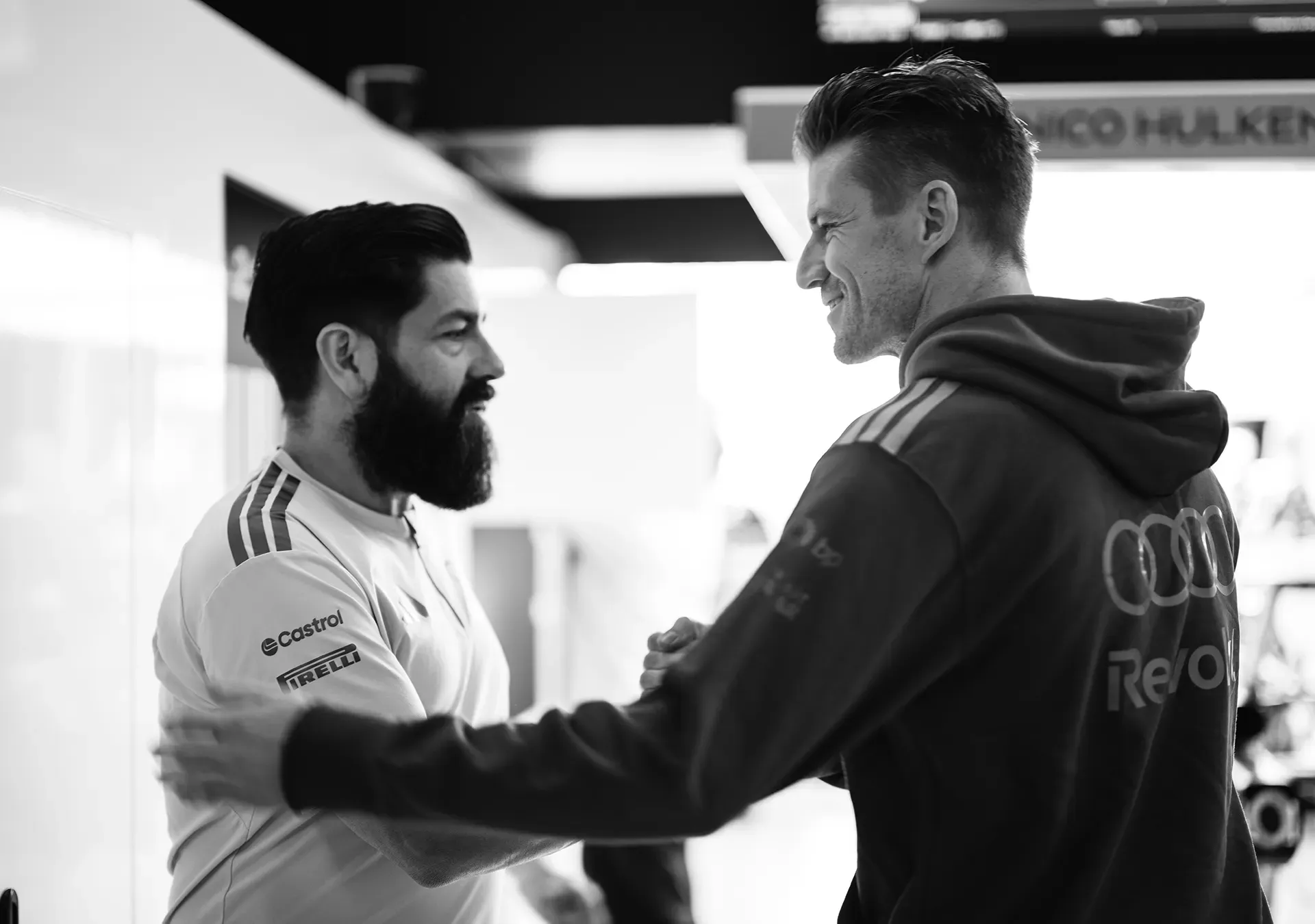 Nico saying hi to a mechanic in the garage