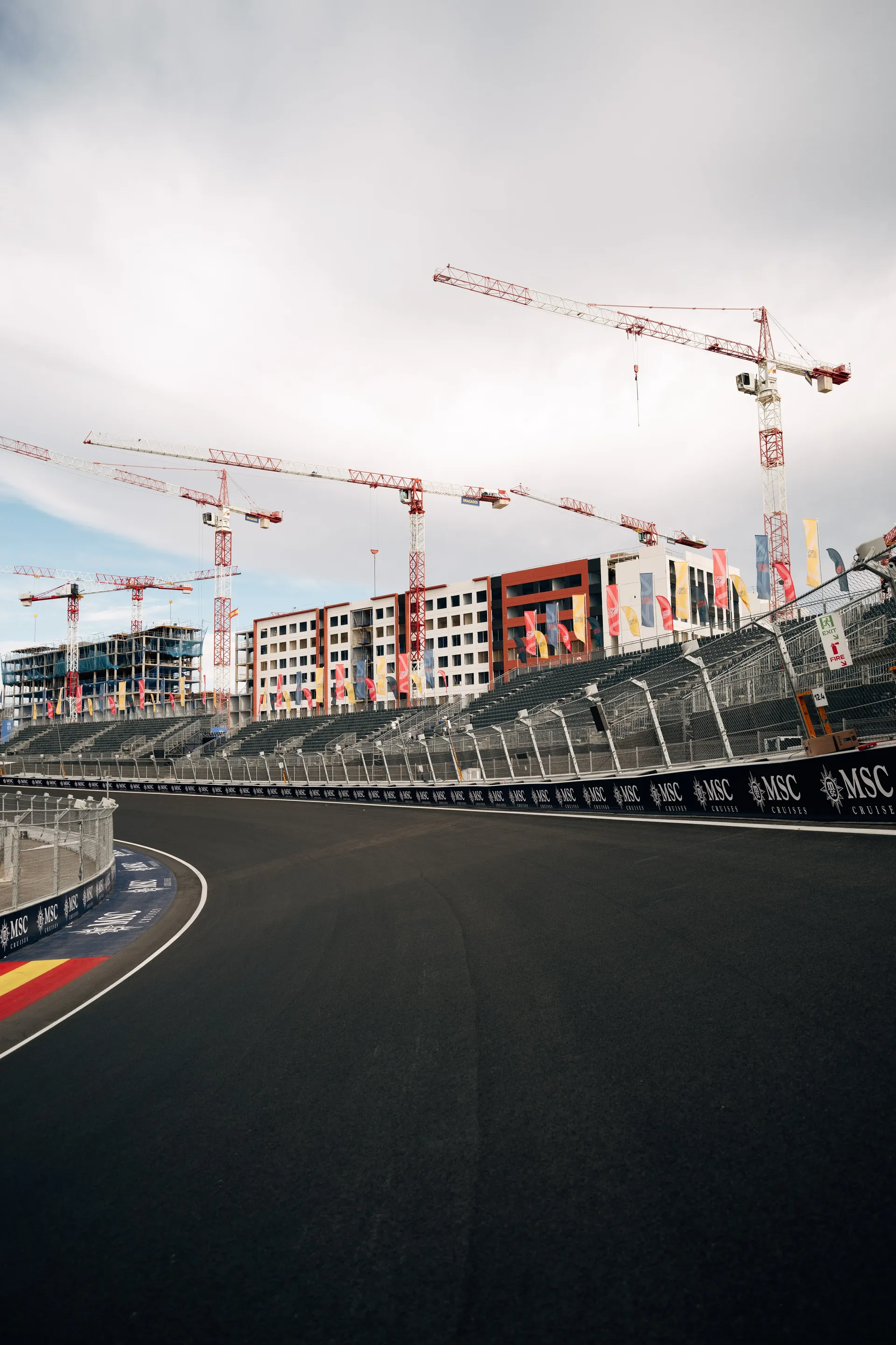 Empty corner of the Madring circuit with grandstand and construction cranes ahead of the Audi Revolut F1® Team race weekend in Madrid