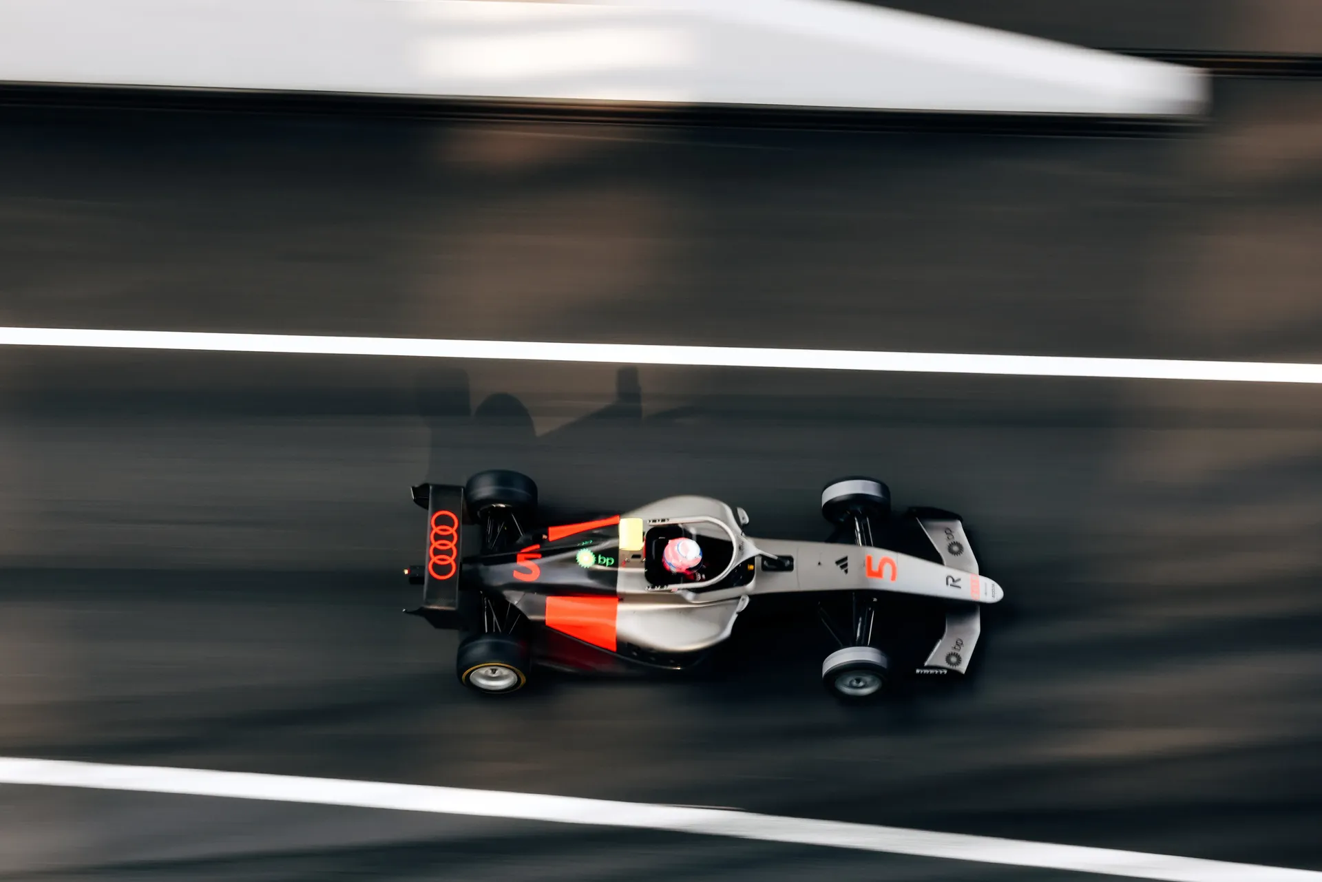 To view of  the Audi Revolut F1® Team Academy car number 5 on the race track, Emma Felbermayr