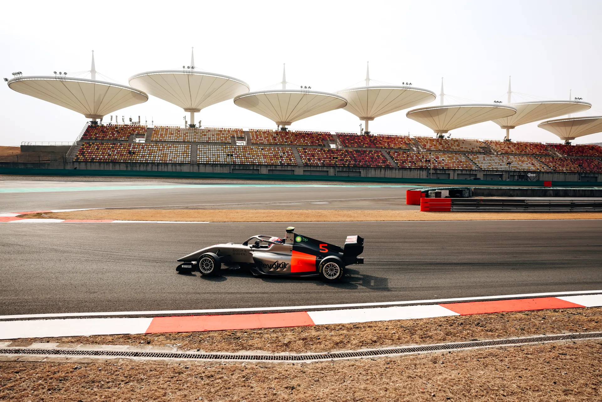 Sideview of  the Audi Revolut F1® Team Academy car number 5 on the race track, Emma Felbermayr