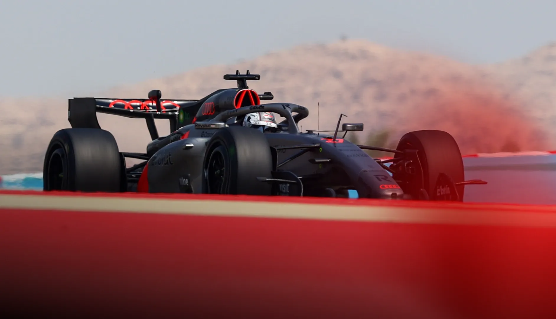 Sideview of Audi Revolut F1® Team car on track at Bahrain Roundup