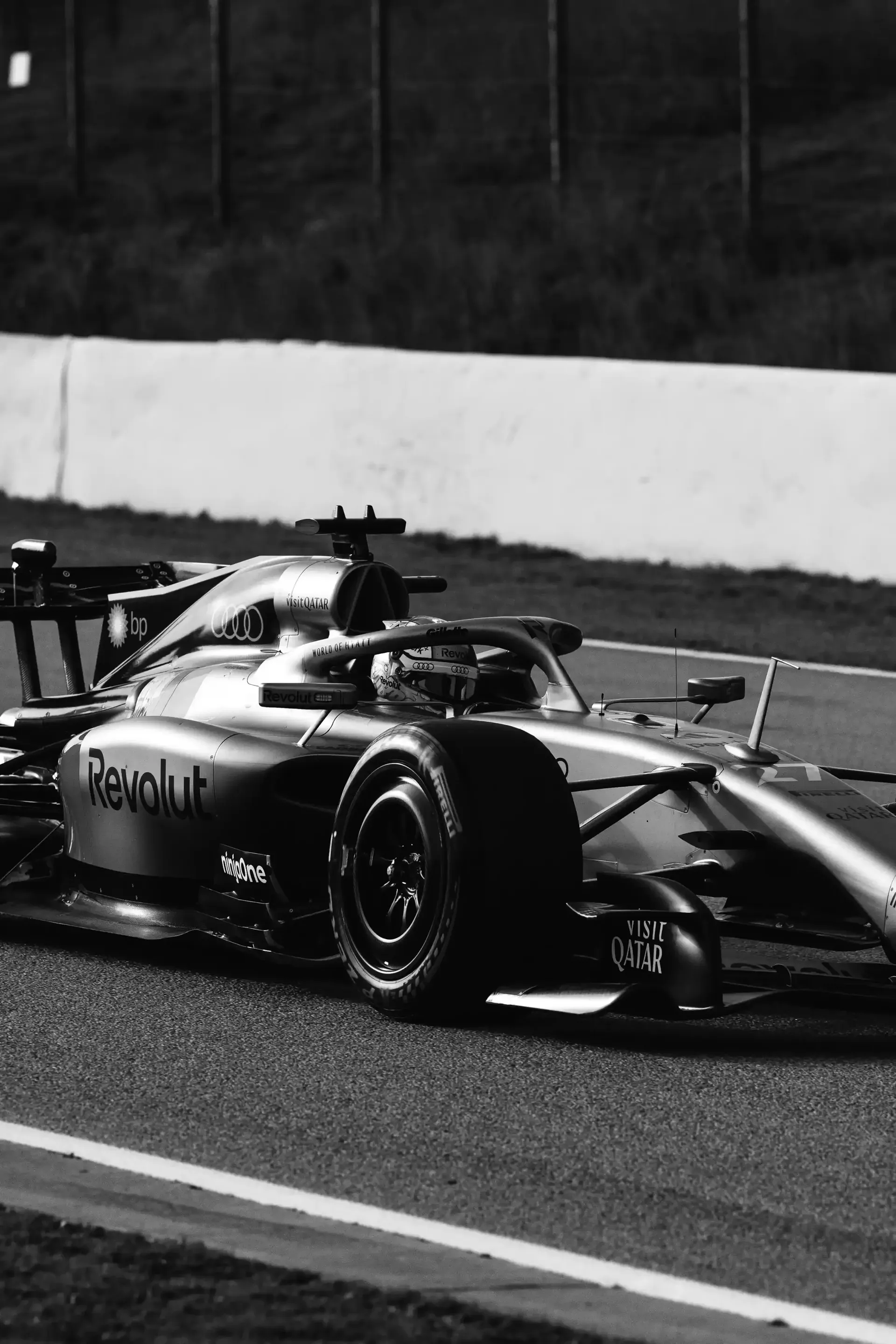 Front view of the Audi Revolut F1® Team R26 car on the racetrack black and white