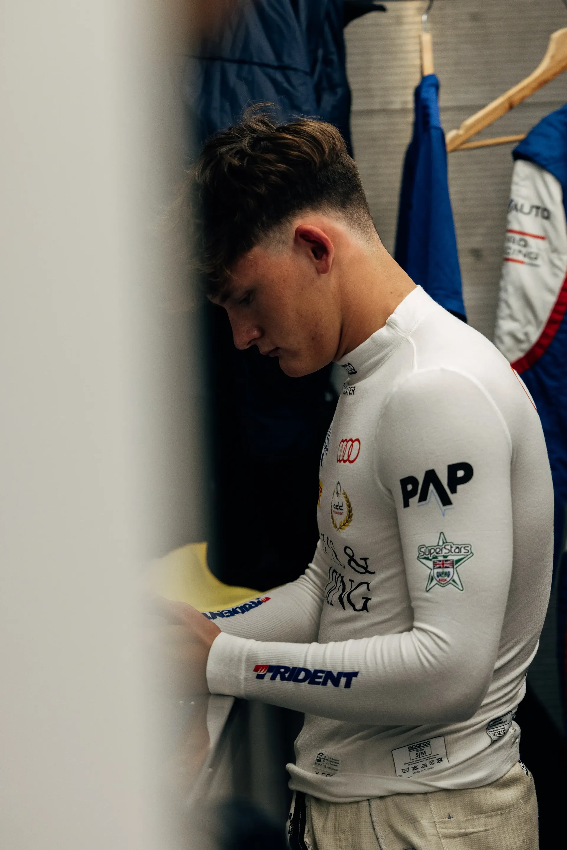 Audi Revolut F1® Team Academy driver Freddie Slater prepares inside the paddock during the FIA Formula 3 weekend at the Hungaroring.