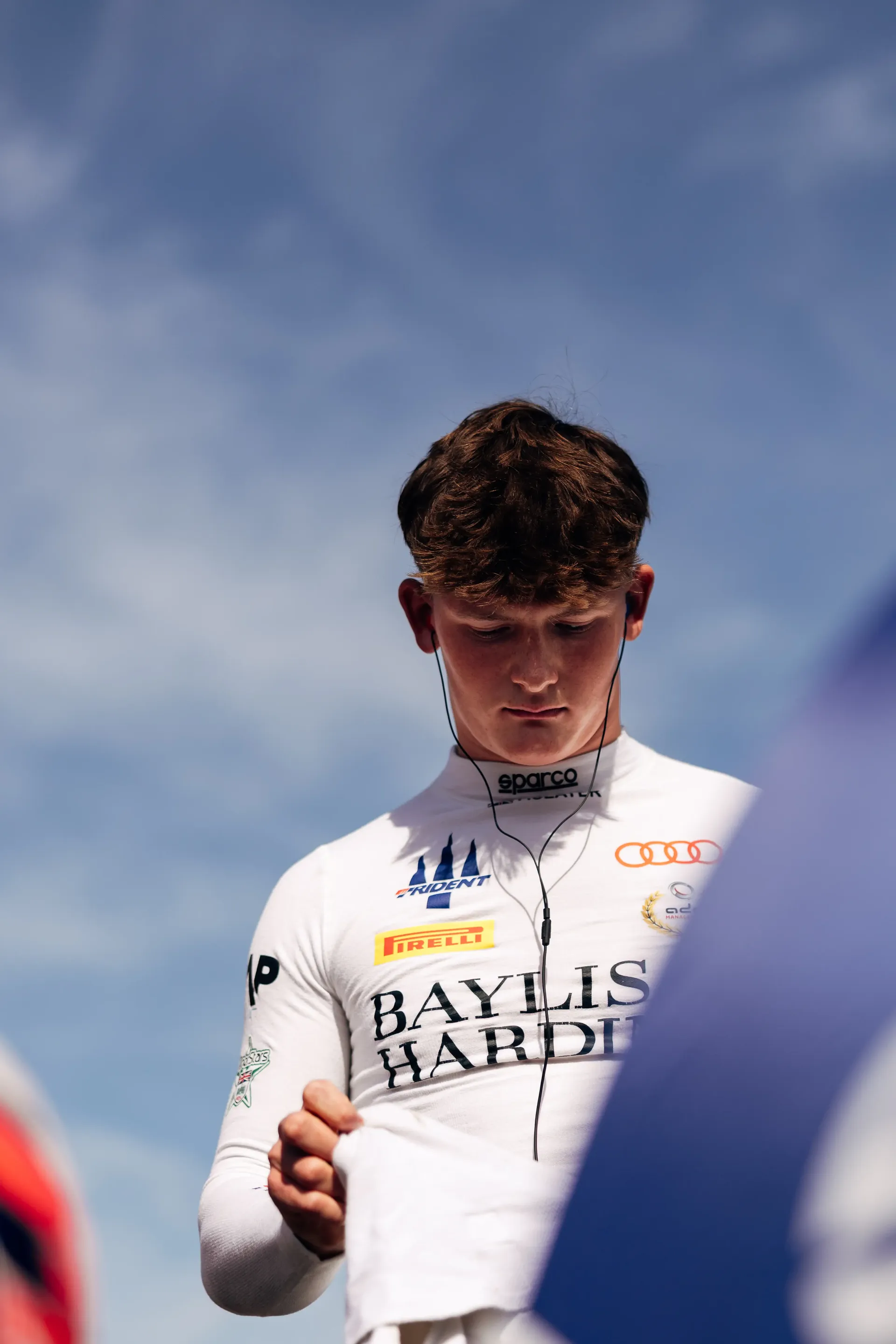 Audi Revolut F1® Team Academy driver Freddie Slater looks towards the camera in the FIA Formula 3 paddock at the Hungaroring.