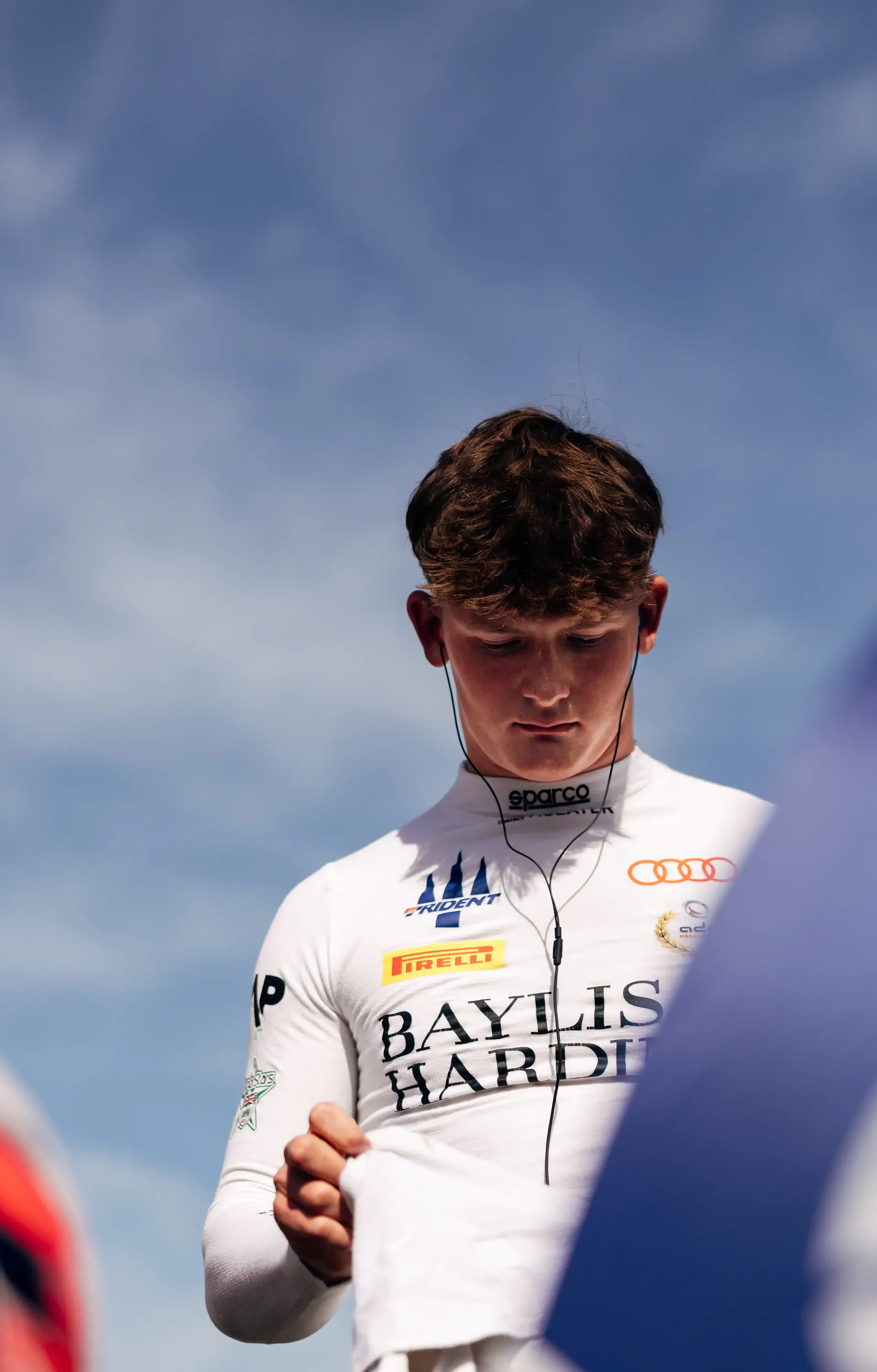 Audi Revolut F1® Team Academy driver Freddie Slater looks towards the camera in the FIA Formula 3 paddock at the Hungaroring.