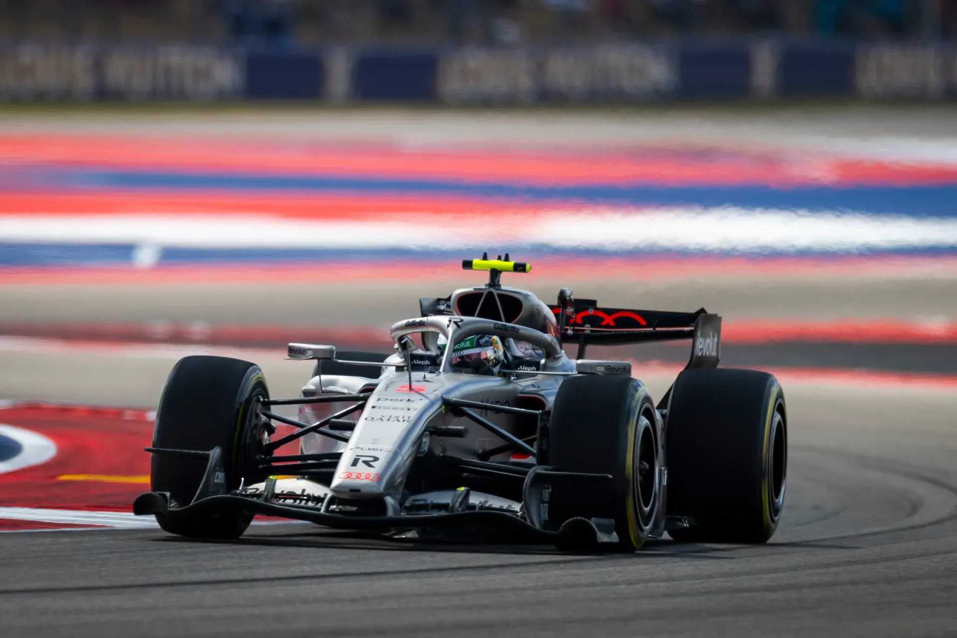 Gabriel Bortoleto in the number 5 car of the Audi Revolut F1® Team cornering past red and blue kerbs in Austin