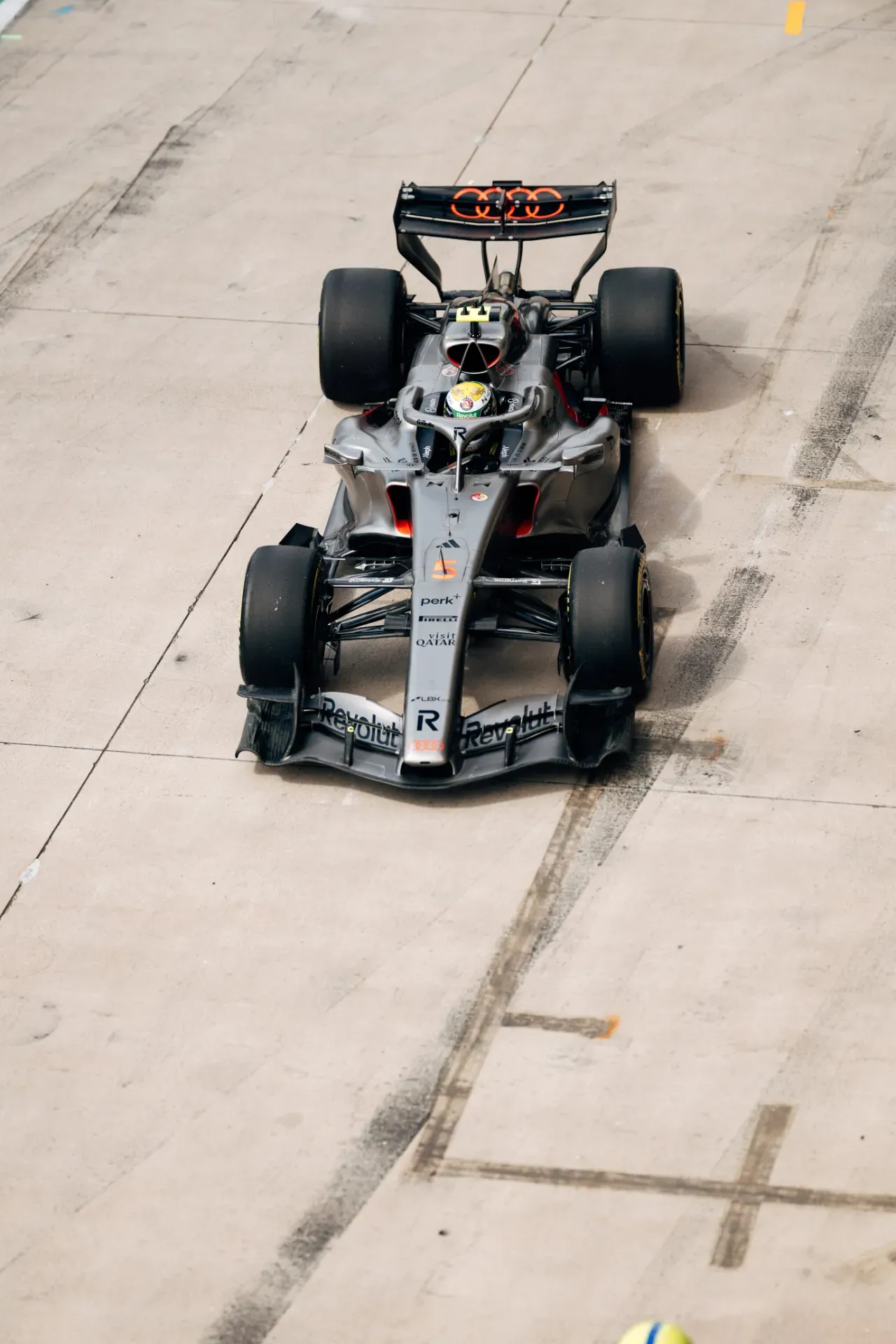 Car number 5 of the Audi Revolut F1® Team drives down the pit lane in Austin, seen from above