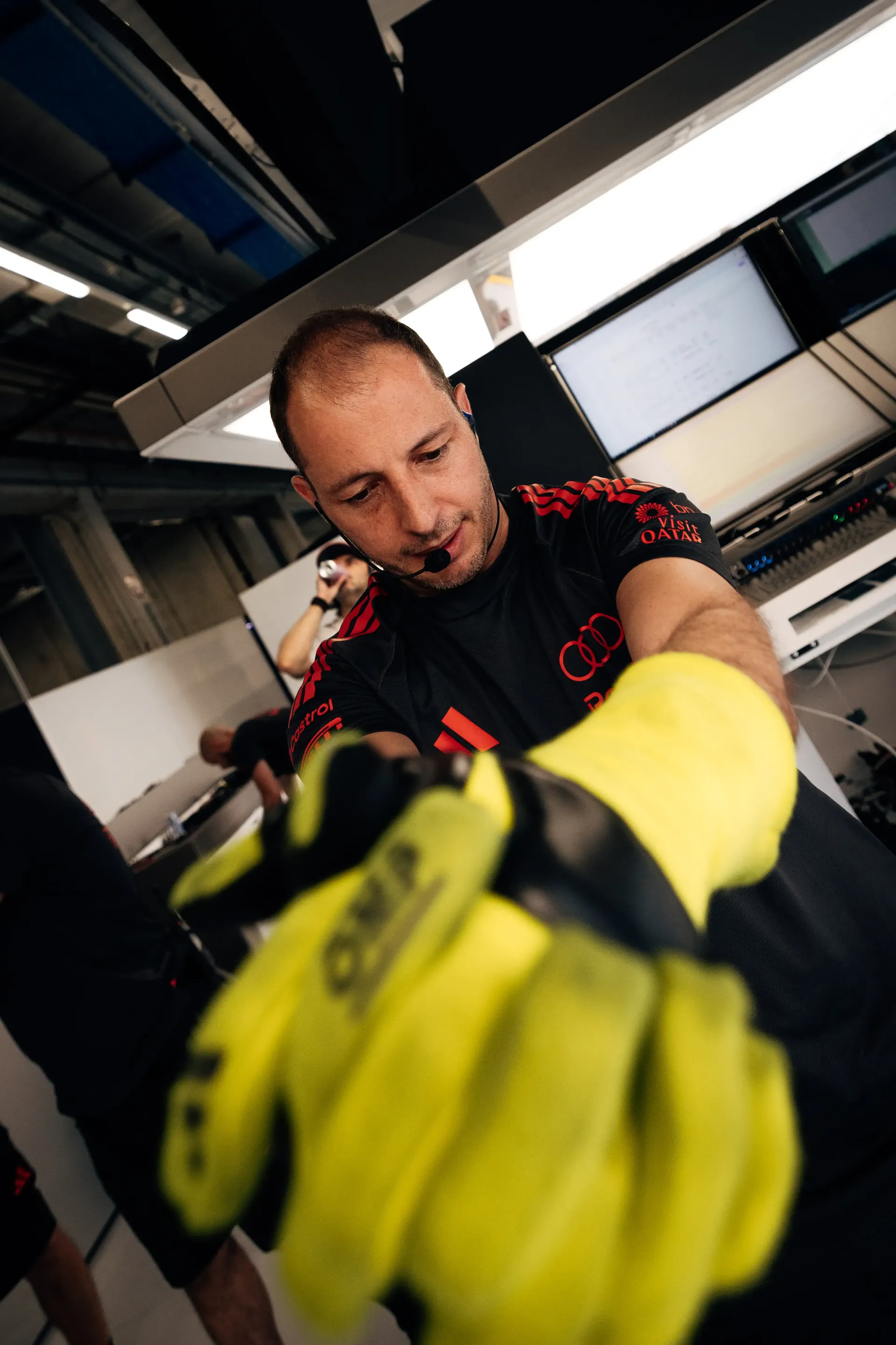 Audi Revolut F1® Team pit stop crew members prepare equipment inside the garage ahead of the Formula 1® Austrian Grand Prix at the Red Bull Ring.