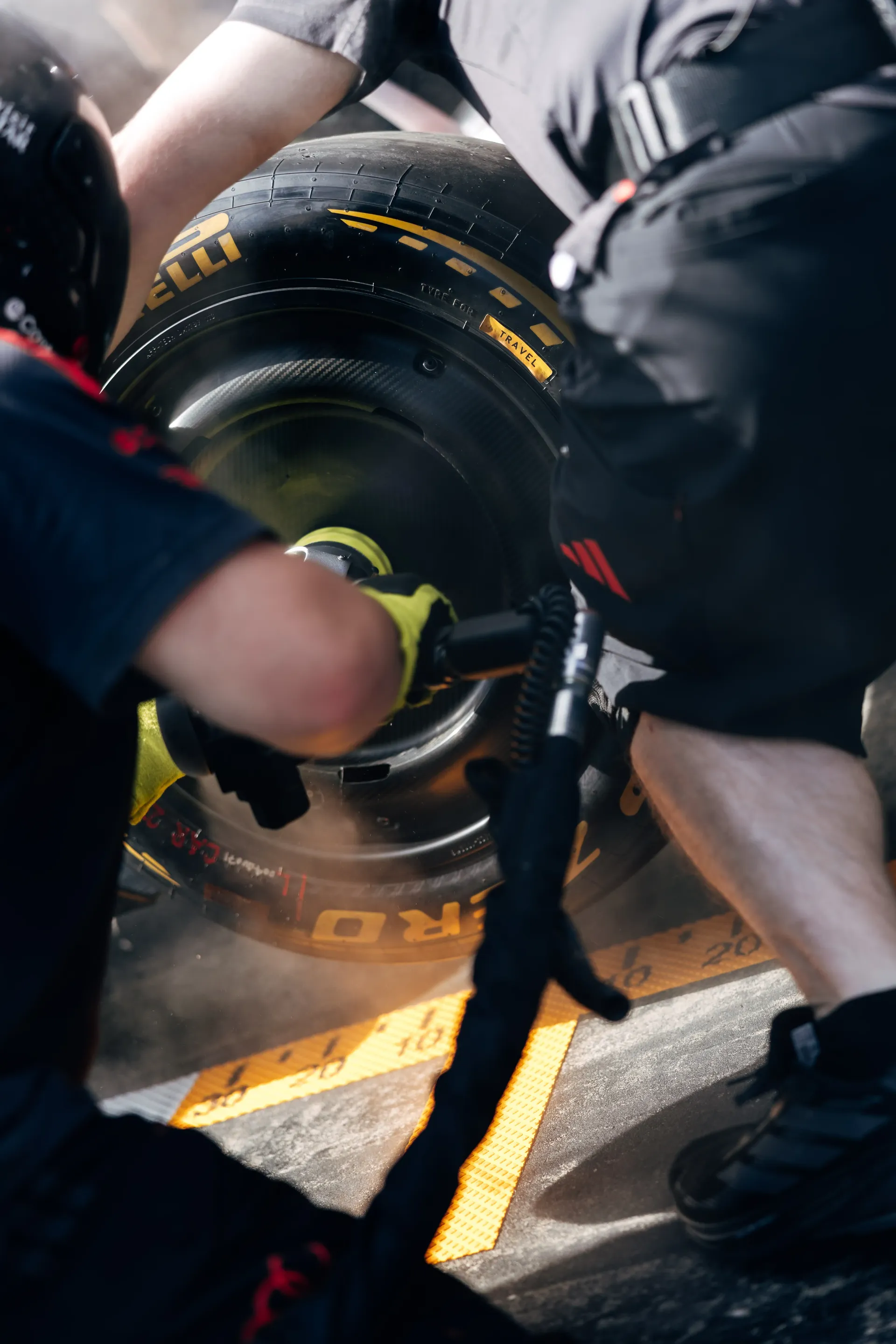 Close-up of an Audi Revolut F1® Team pit stop crew member operating a wheel gun during pit stop practice ahead of the Formula 1® Austrian Grand Prix at the Red Bull Ring.
