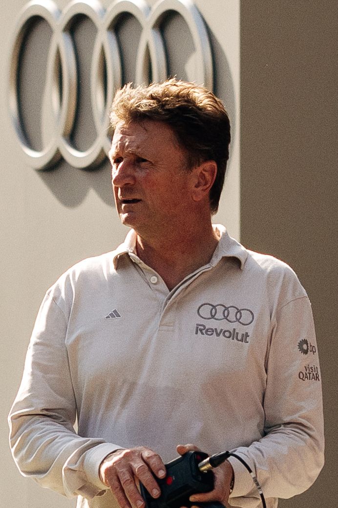 Audi Revolut F1® Team racing director Allan McNish walks around the paddock