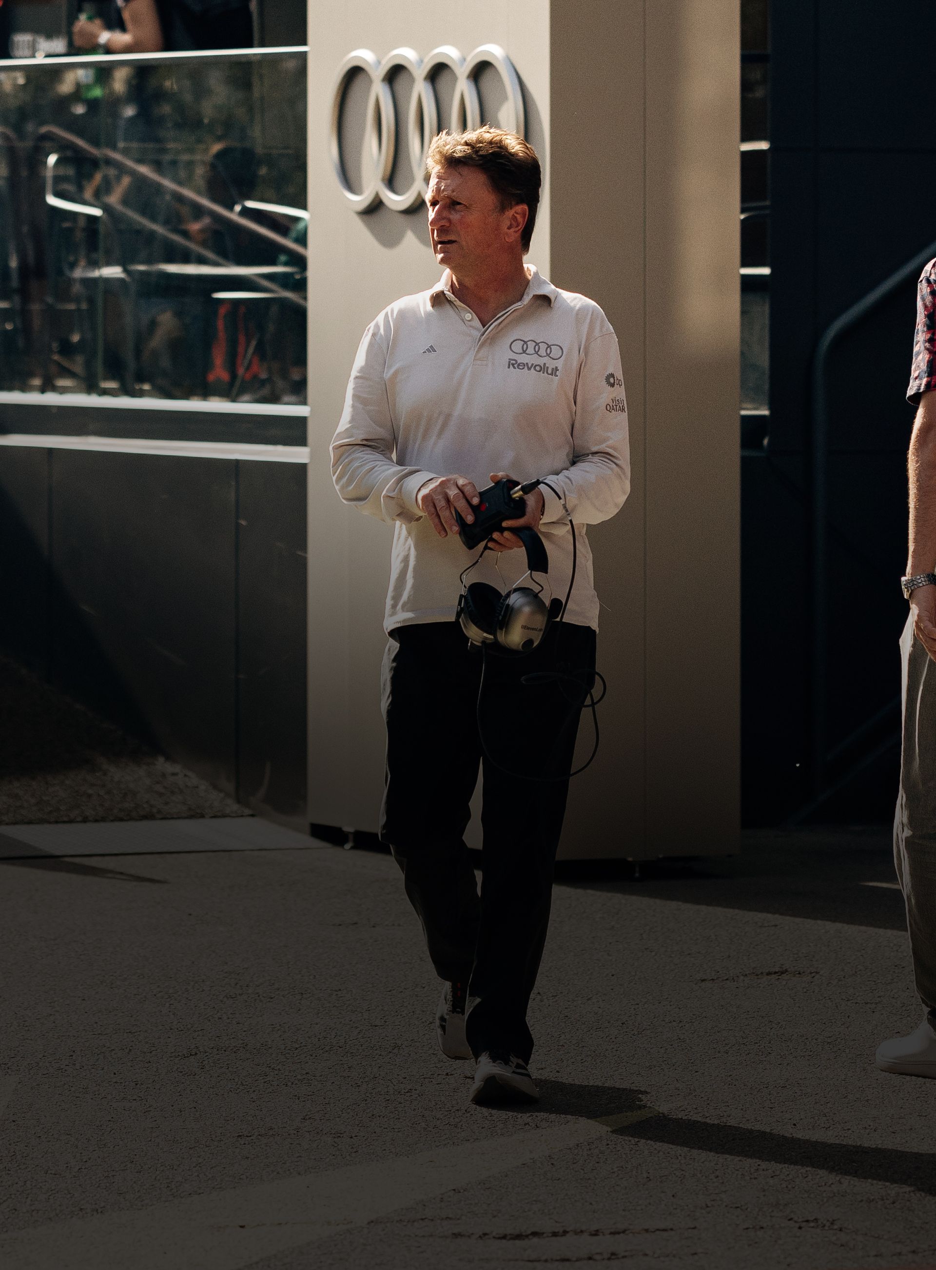 Audi Revolut F1® Team racing director Allan McNish walks around the paddock