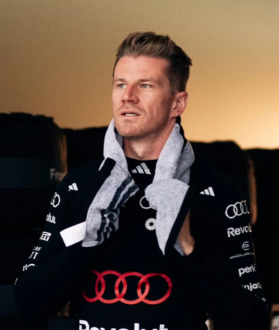 Audi Revolut F1® Team driver Nico Hulkneberg walks inside the garage