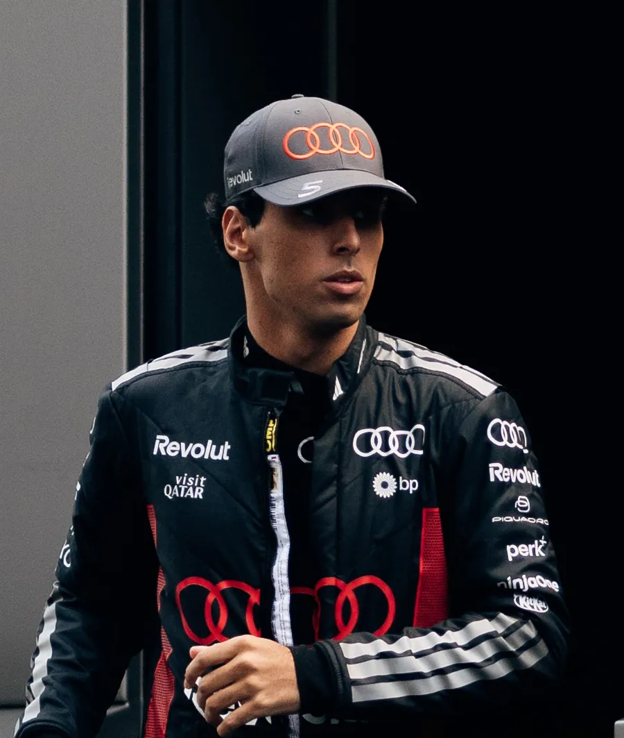 Audi Revolut F1® Team driver Gabriel Bortoleto walks inside the garage
