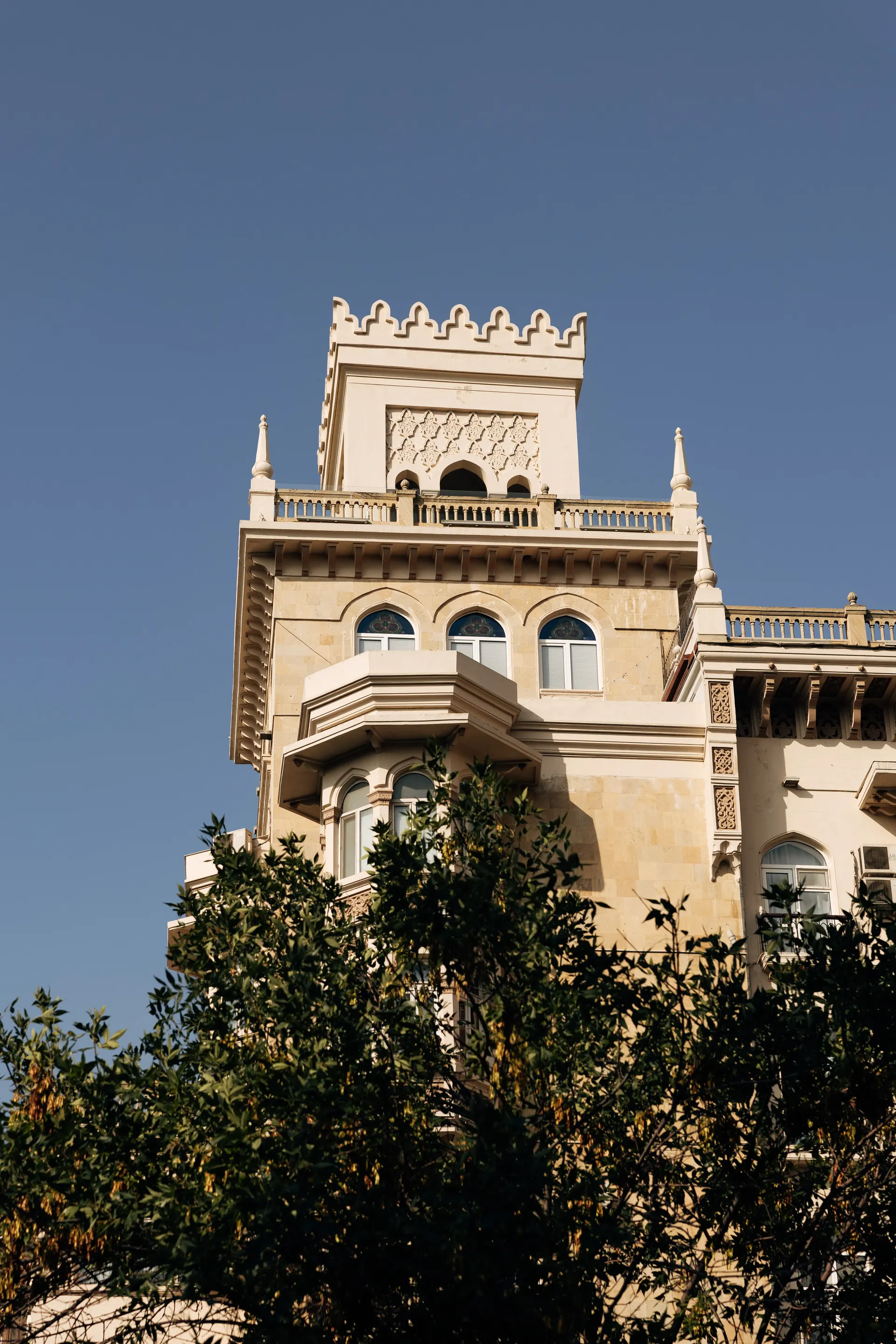 Historic building surrounded by greenery in Baku, Azerbaijan
