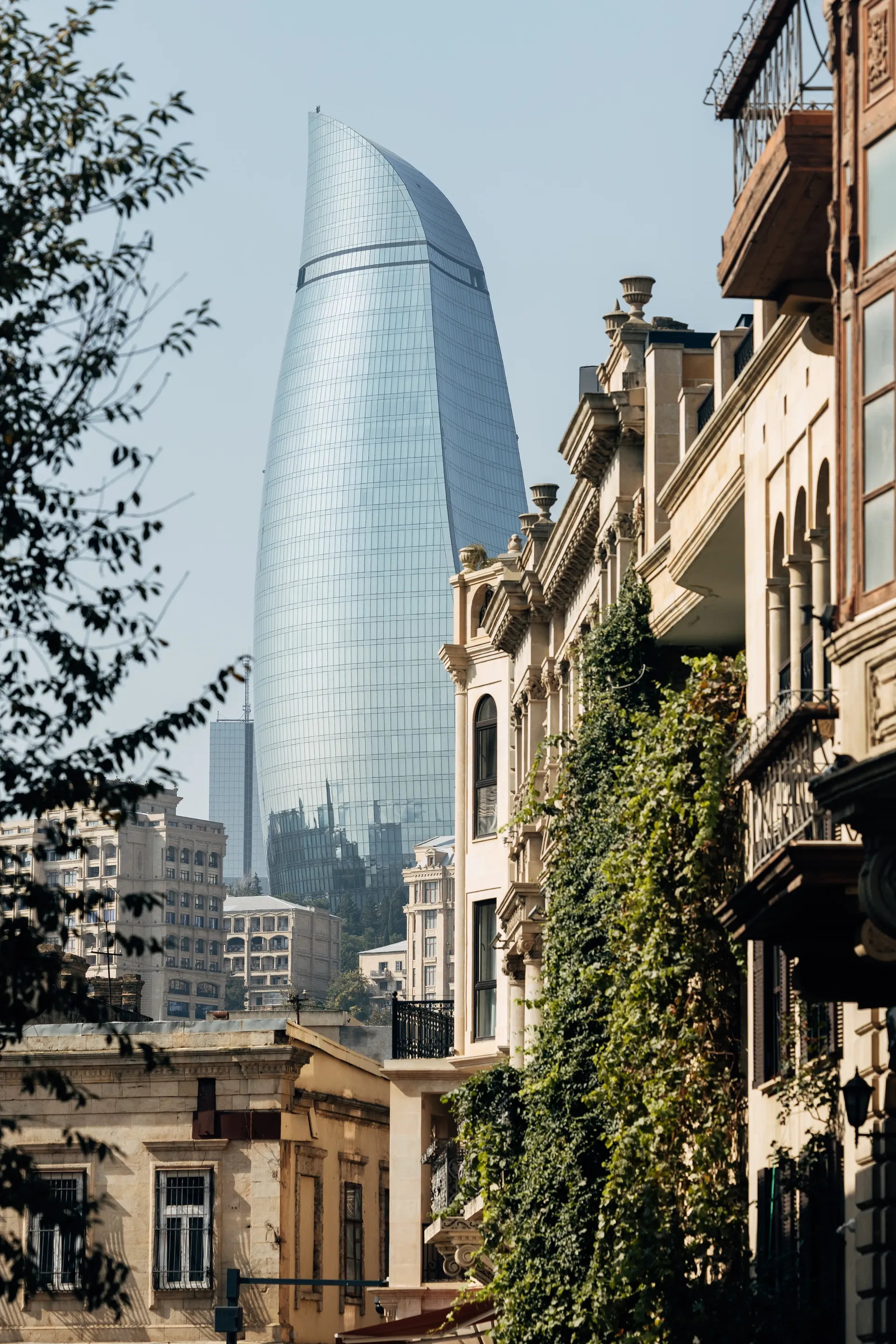 Flame Tower overlooking a historic street in Baku, Azerbaijan