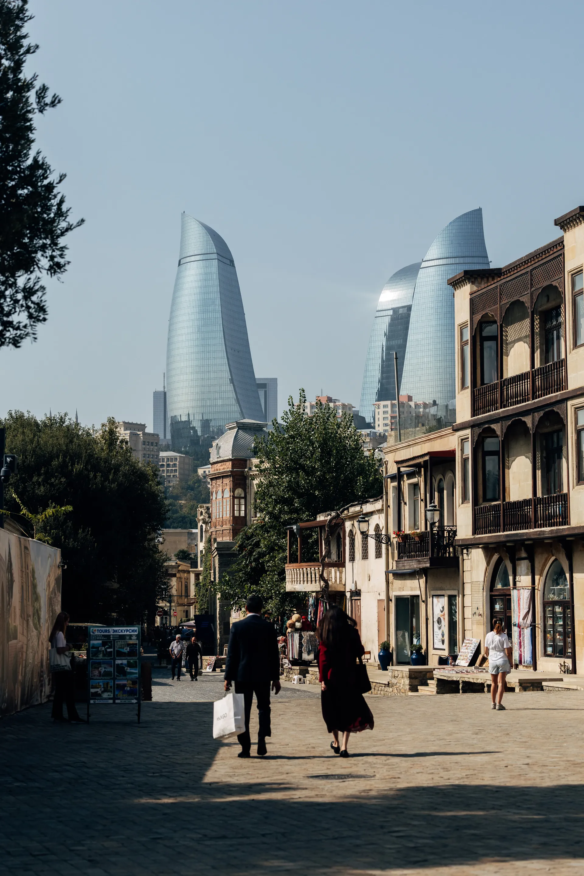 Historic Baku street with the Flame Towers in the background