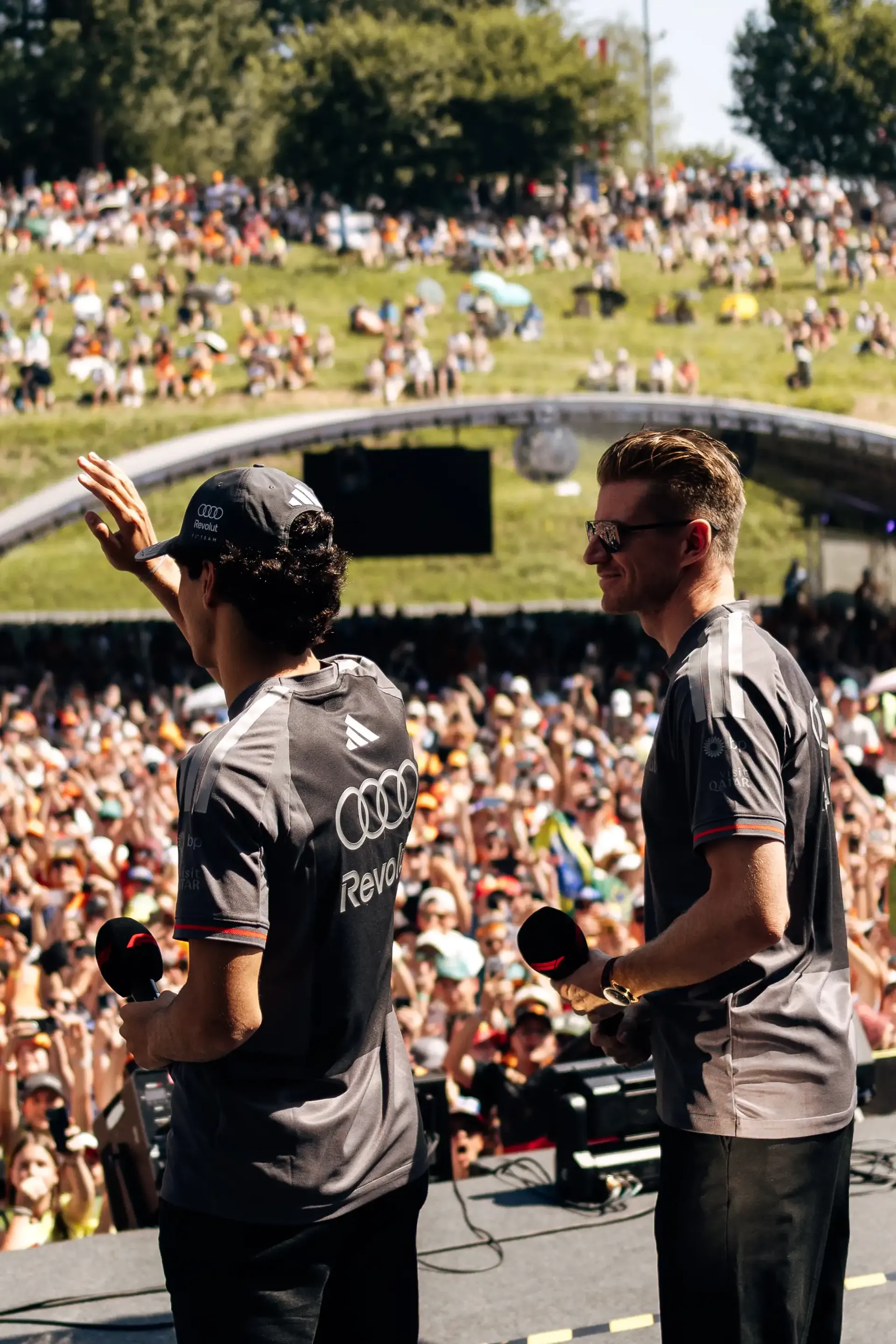 Gabriel Bortoleto and Nico Hulkenberg appear on stage during the fan forum ahead of FP3 at the Formula 1® Austrian Grand Prix at the Red Bull Ring, representing Audi Revolut F1® Team.