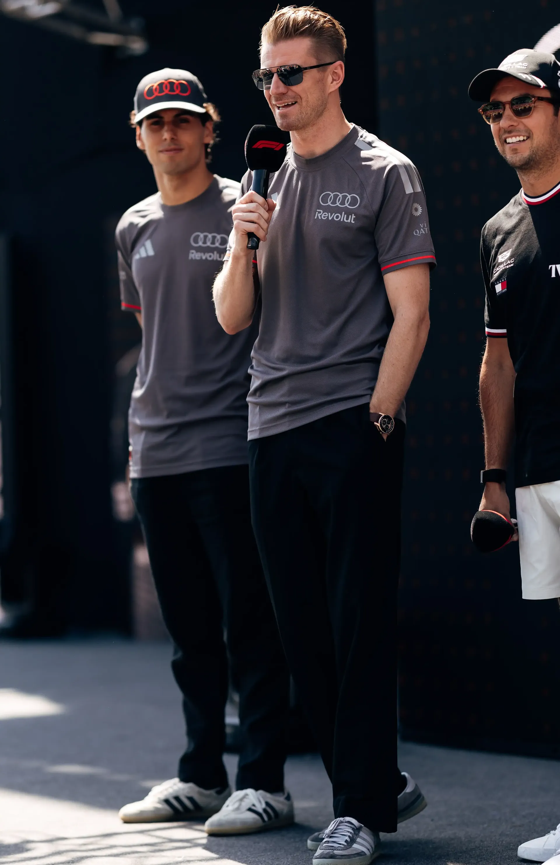 Nico Hulkenberg and Gabriel Bortoleto stand on stage during the fan forum ahead of FP3 at the Formula 1® Austrian Grand Prix at the Red Bull Ring, representing Audi Revolut F1® Team.