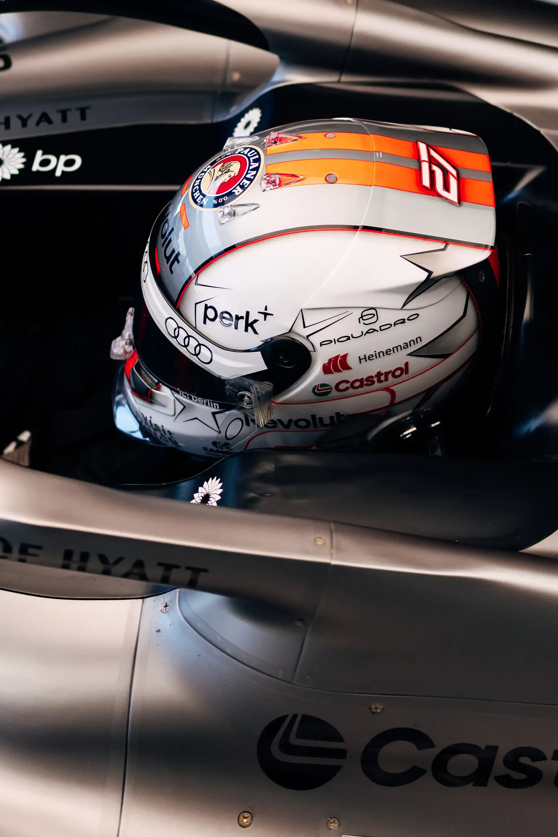 Close-up of Nico Hülkenberg's racing helmet inside the cockpit of the Audi Revolut F1® Team car Audi R26during FP3 at the Austrian Grand Prix in Spielberg, Austria.