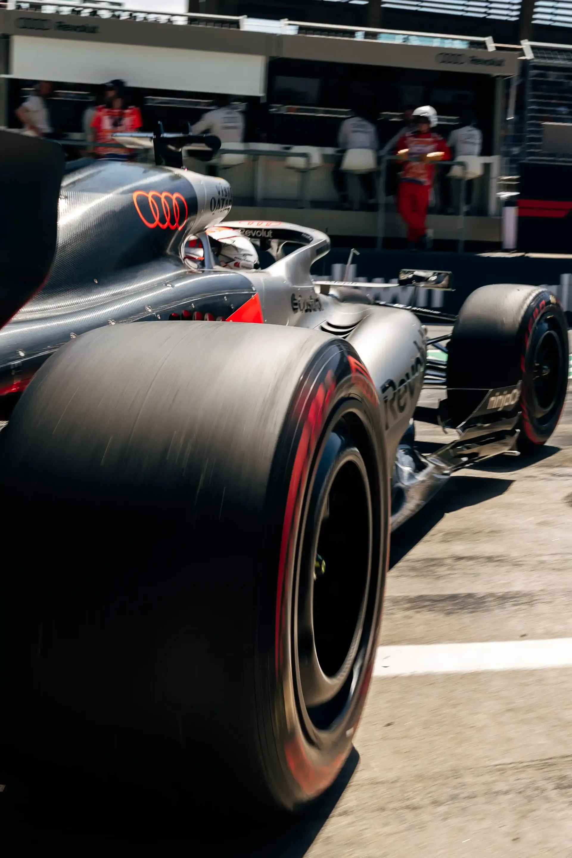 Low-angle rear view of the Audi R26 leaving the Audi Revolut F1® Team garage during FP3 at the Austrian Grand Prix in Spielberg.