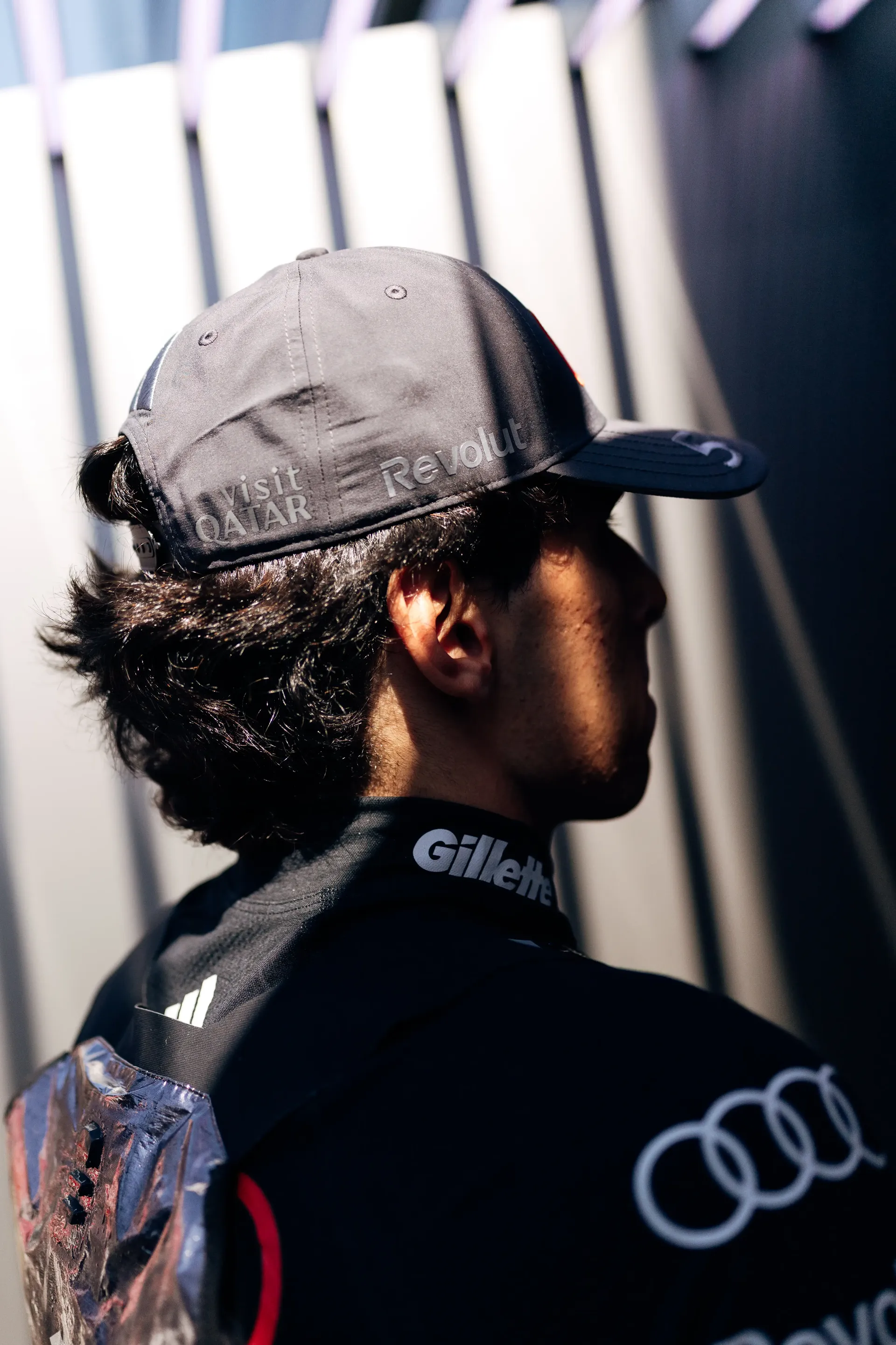 Rear view of an Audi Revolut F1® Team driver Gabriel Bortoleto in the paddock ahead of Qualifying at the Austrian Grand Prix in Spielberg.