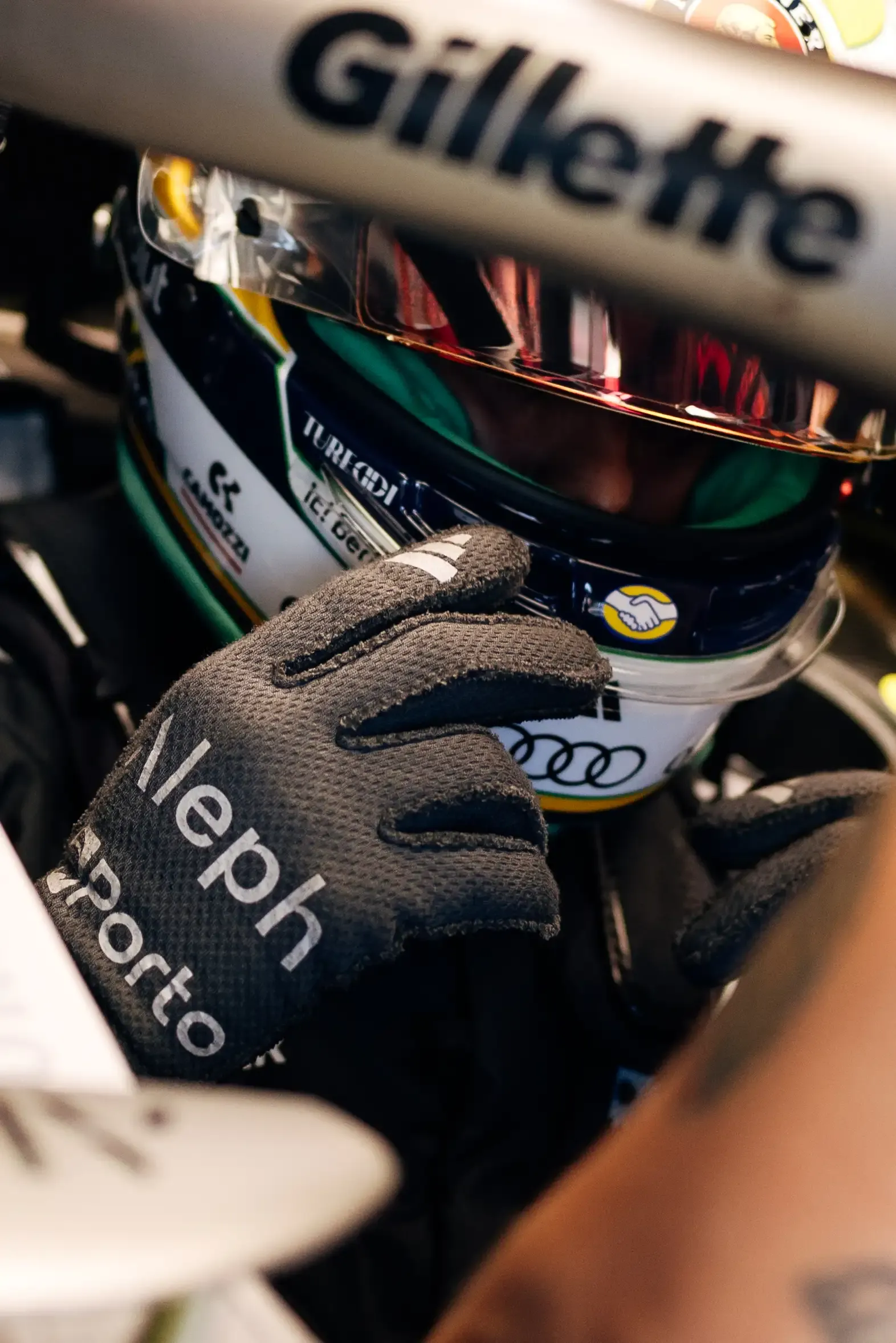 Close-up of an Audi Revolut F1® Team driver Gabriel Bortoleto adjusting their helmet inside the Audi R26 during Qualifying at the Austrian Grand Prix in Spielberg.
