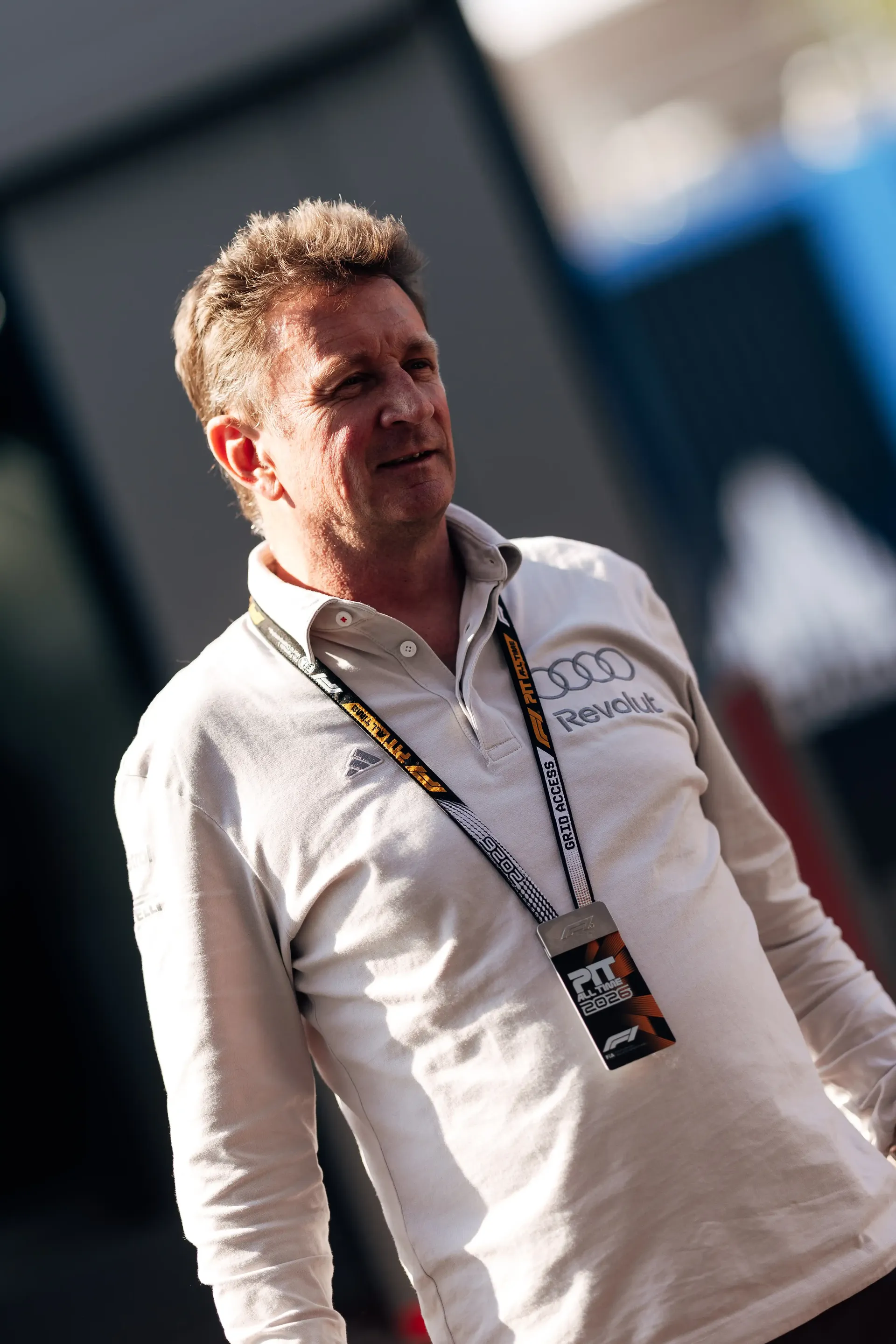 Allan McNish driving director at the Audi Revolut F1® Team walks trough the paddock at the Austrian Grand Prix 2026 