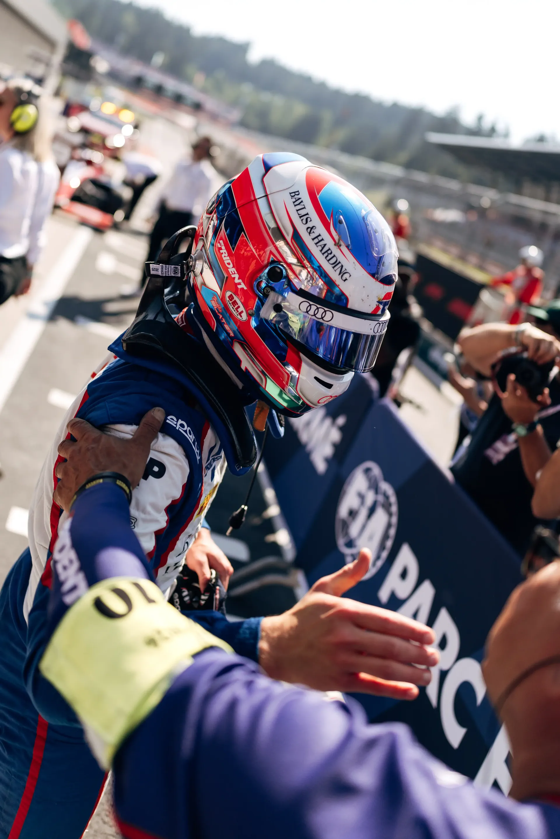 Freddie Slater greets fans in parc fermé after the FIA Formula 3 Feature Race at the Austrian Grand Prix in Spielberg.
