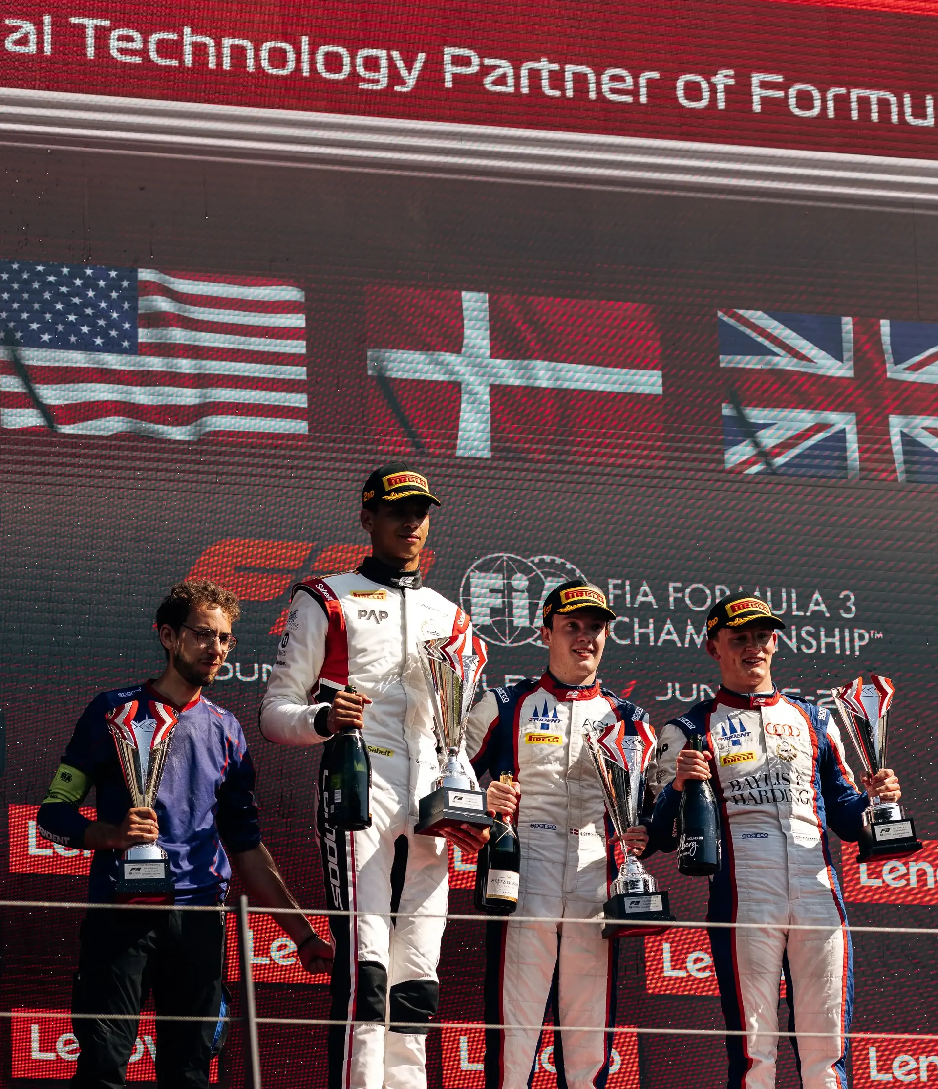 Freddie Slater celebrates with fellow podium finishers after the FIA Formula 3 Feature Race at the Austrian Grand Prix in Spielberg.