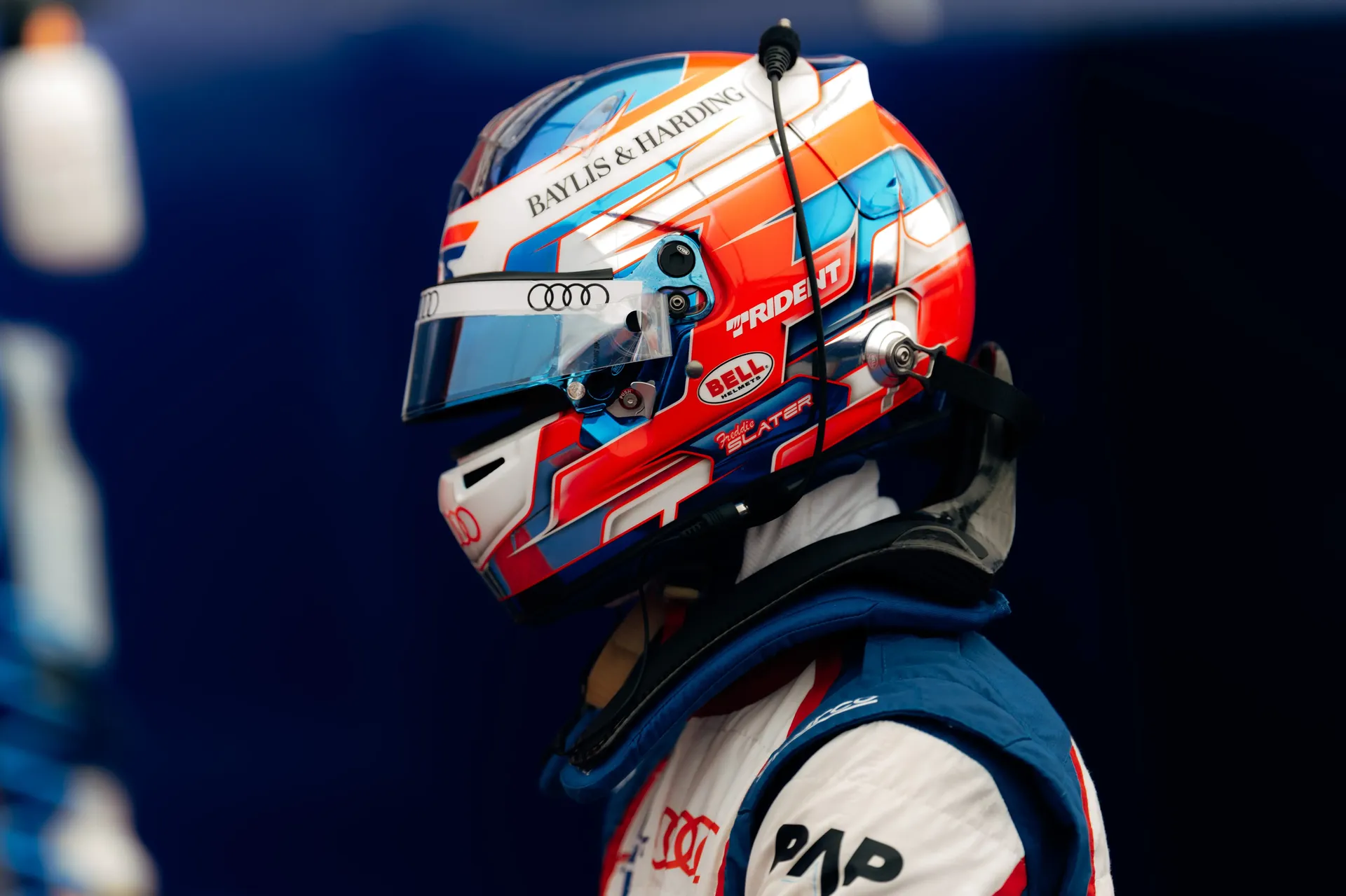 Side profile of Freddie Slater wearing his helmet before taking to the track for the FIA Formula 3 race at Spielberg.