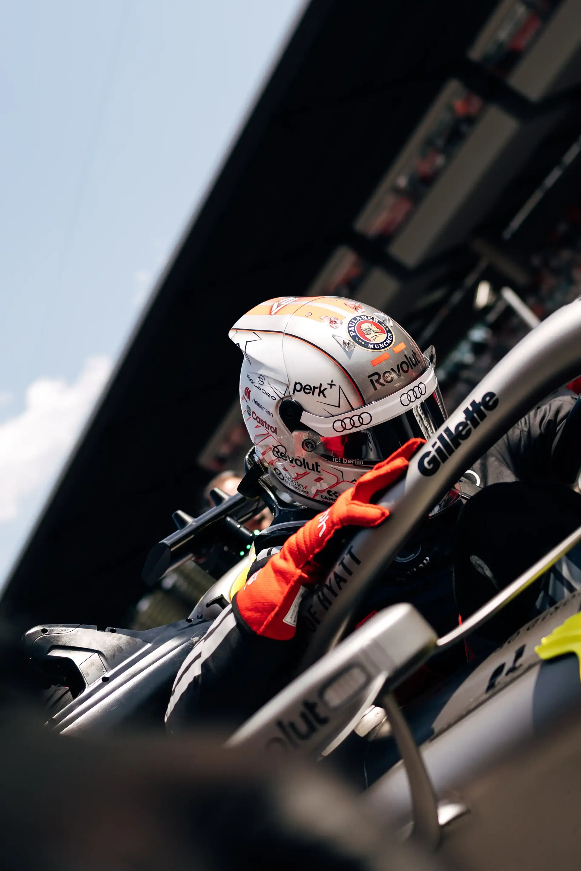 Nico Hulkenberg climbs from the cockpit of the Audi Revolut F1® Team R26 before the race at the Formula 1® Austrian Grand Prix at the Red Bull Ring.